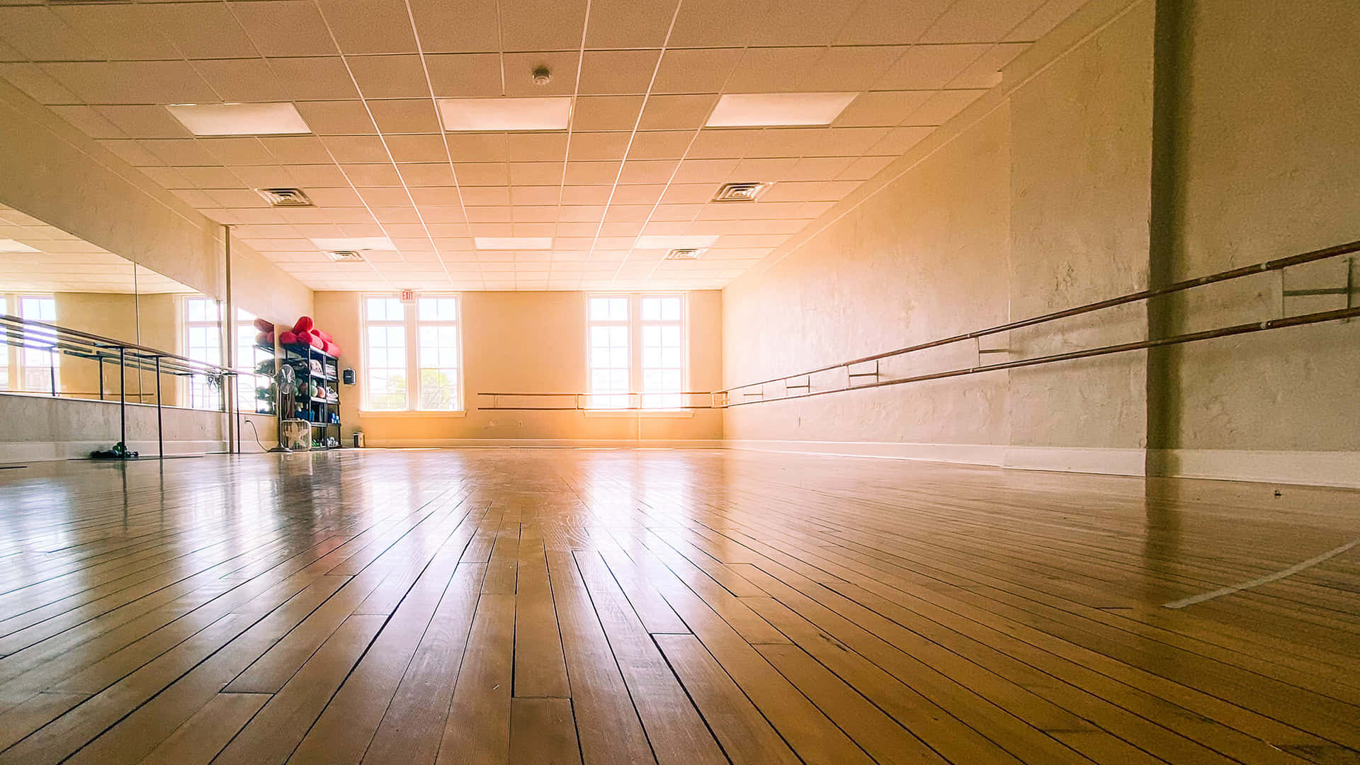Empty Dance Studio With Wooden Floors