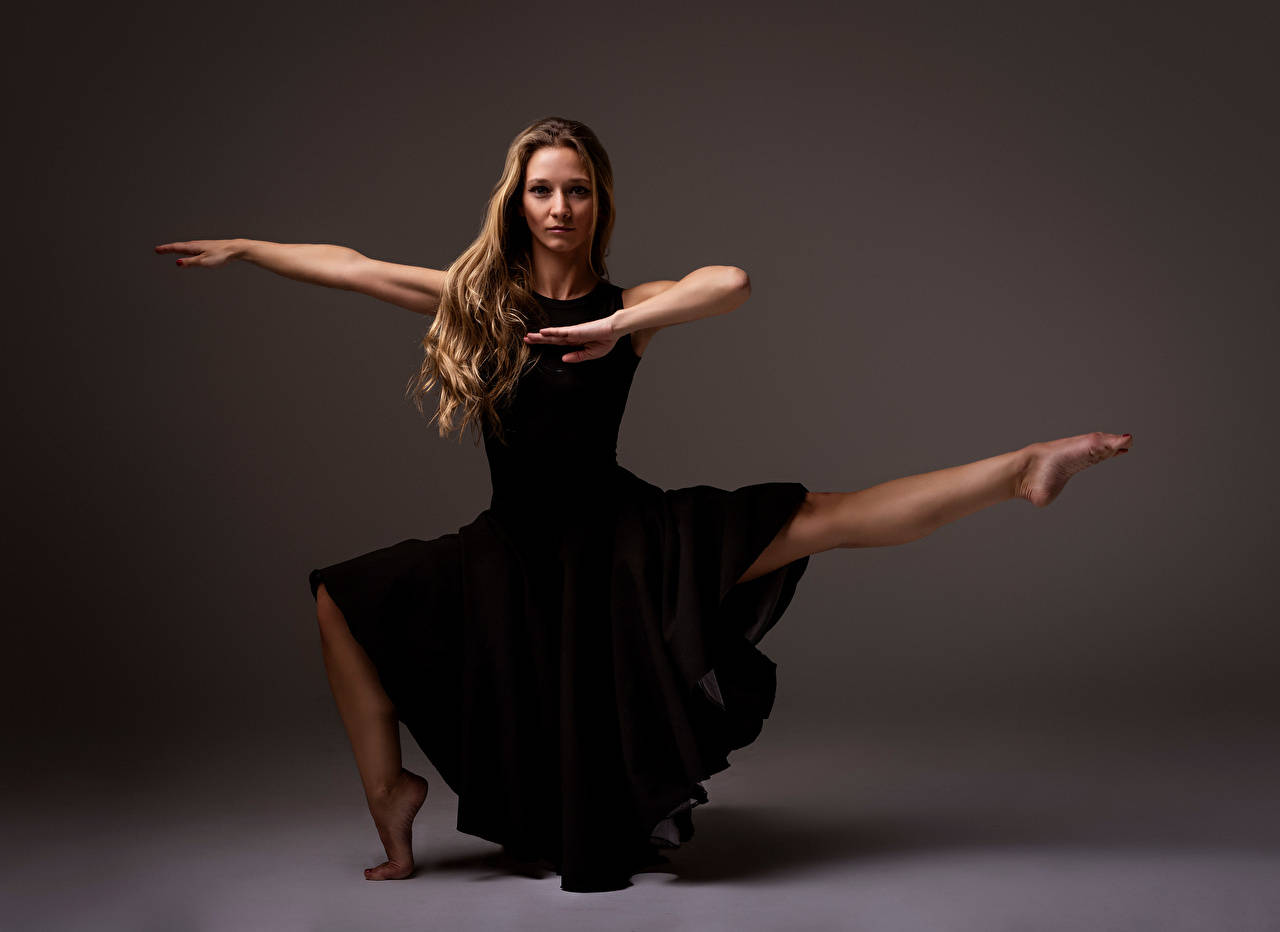 Elegance Embodied: Ballet Dancer striking a pose. Wallpaper