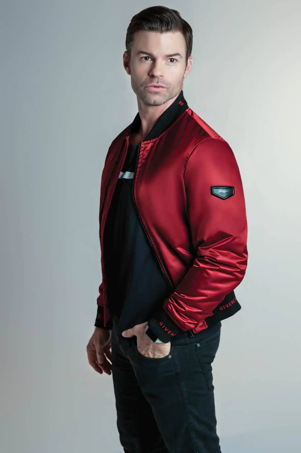 Daniel Gillies Displays Sophisticated Style in a Red Jacket Wallpaper