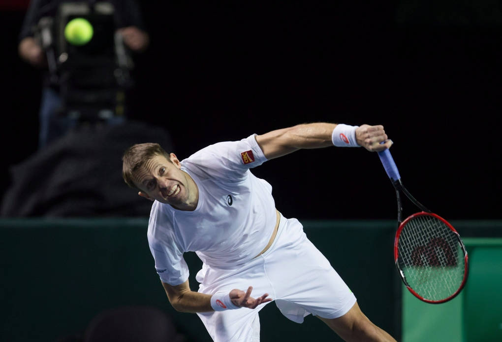 Pro Tennis Player Daniel Nestor in rigorous action Wallpaper