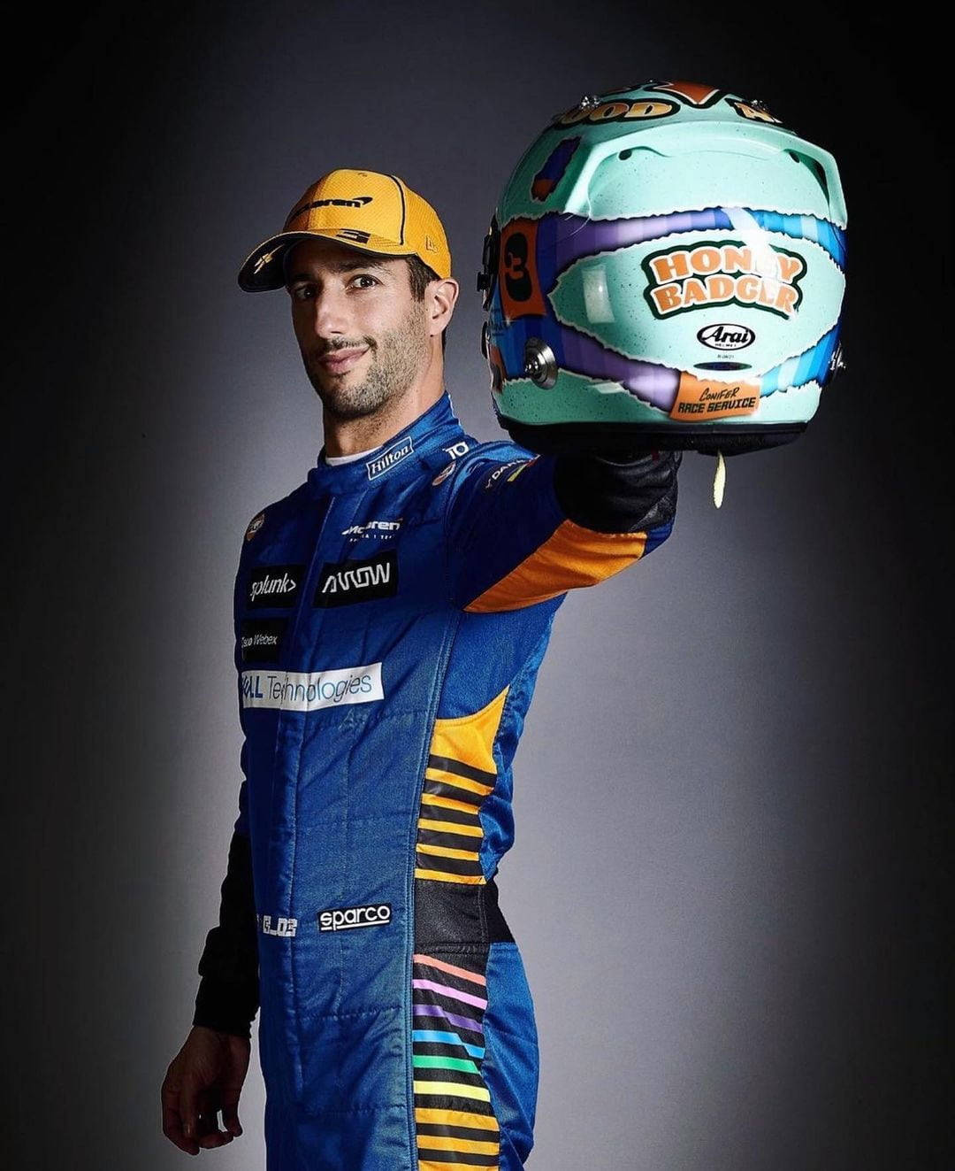 Aussie F1 Star Daniel Ricciardo With His Racing Helmet Wallpaper