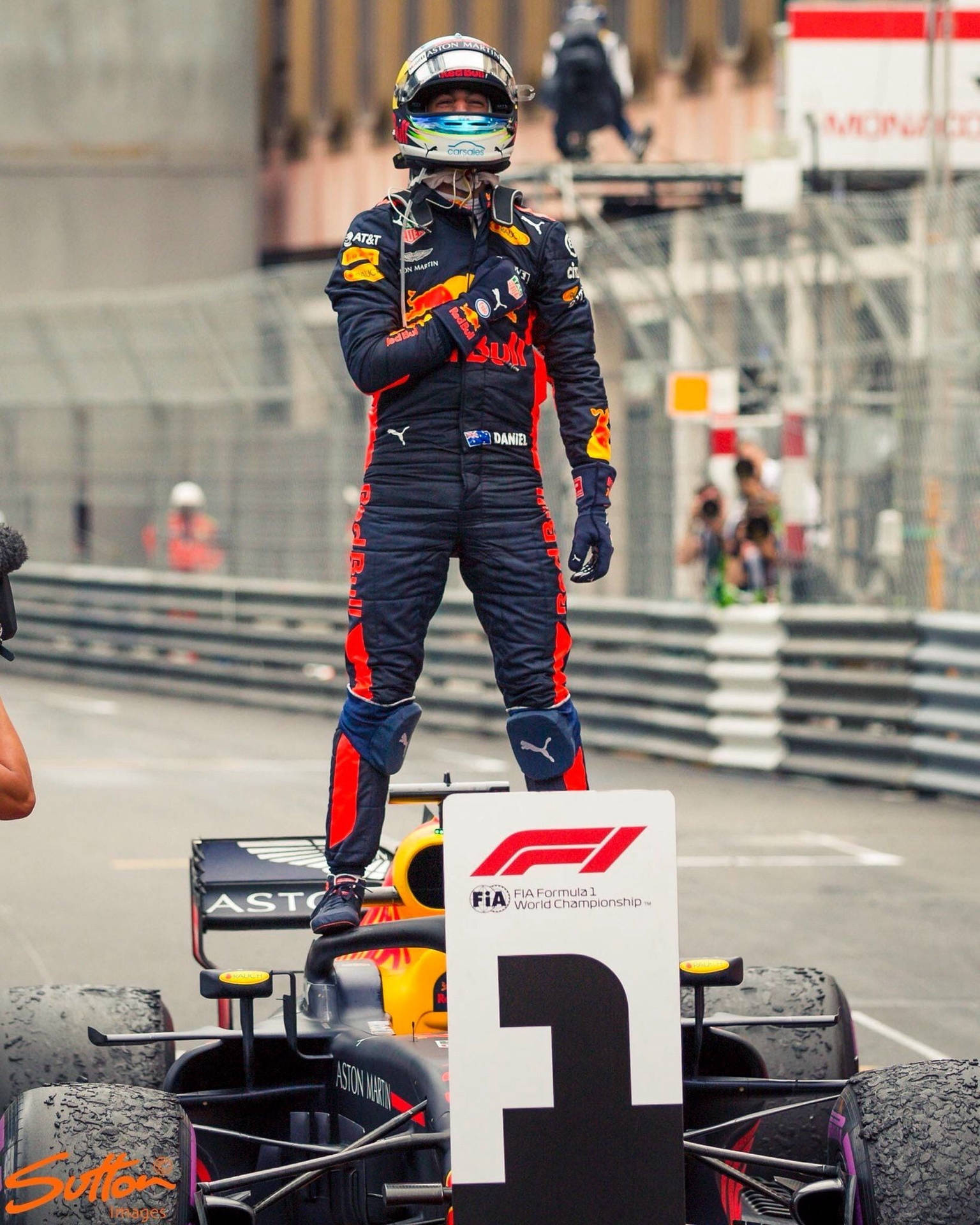 Daniel Ricciardo Standing On Formula One Car Wallpaper
