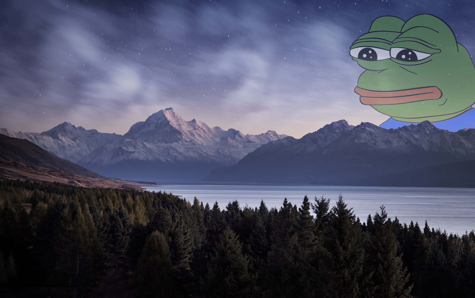A Frog With A Hat And A Mountain In The Background