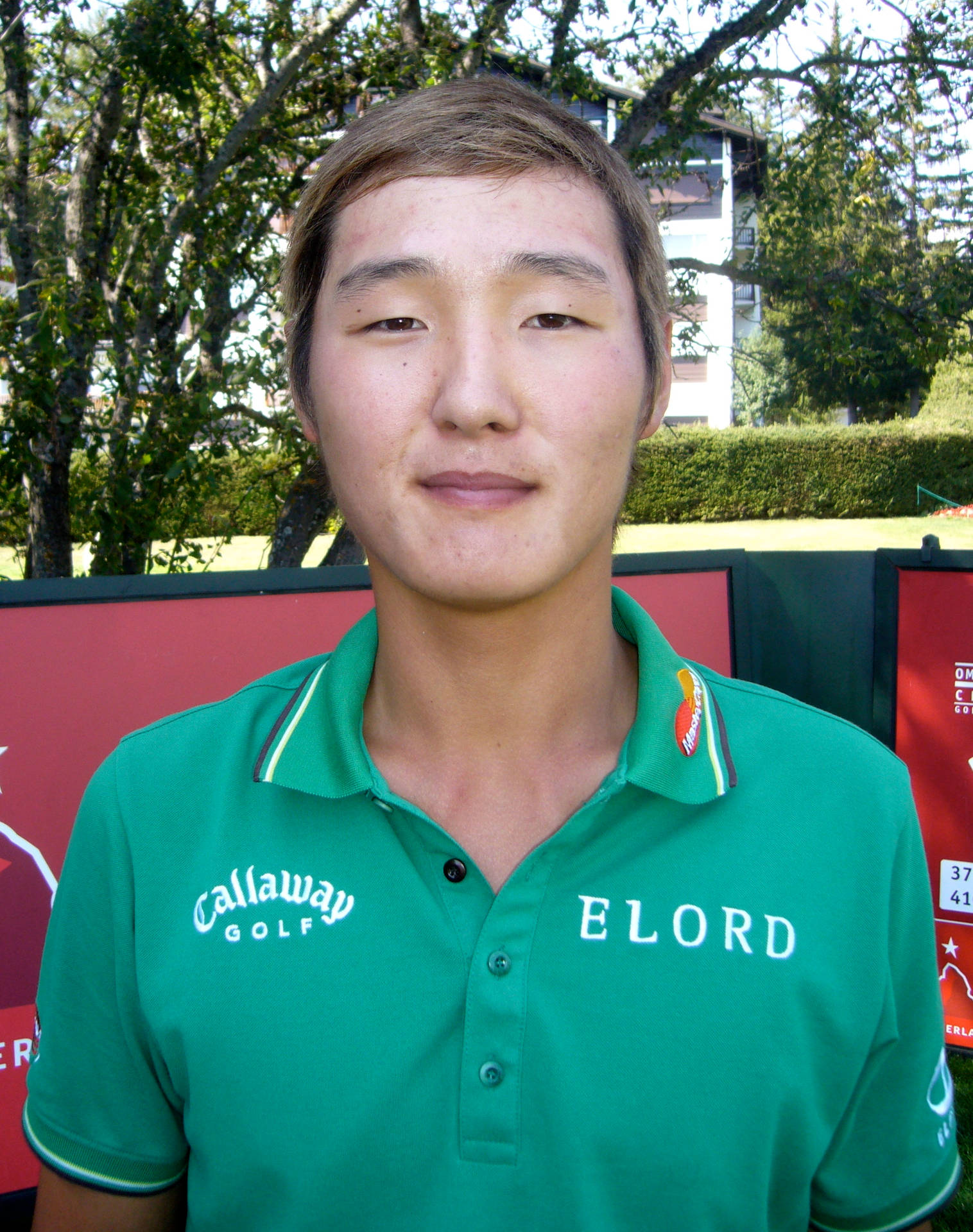 Pro Golfer Danny Lee Sporting a Green Top Wallpaper