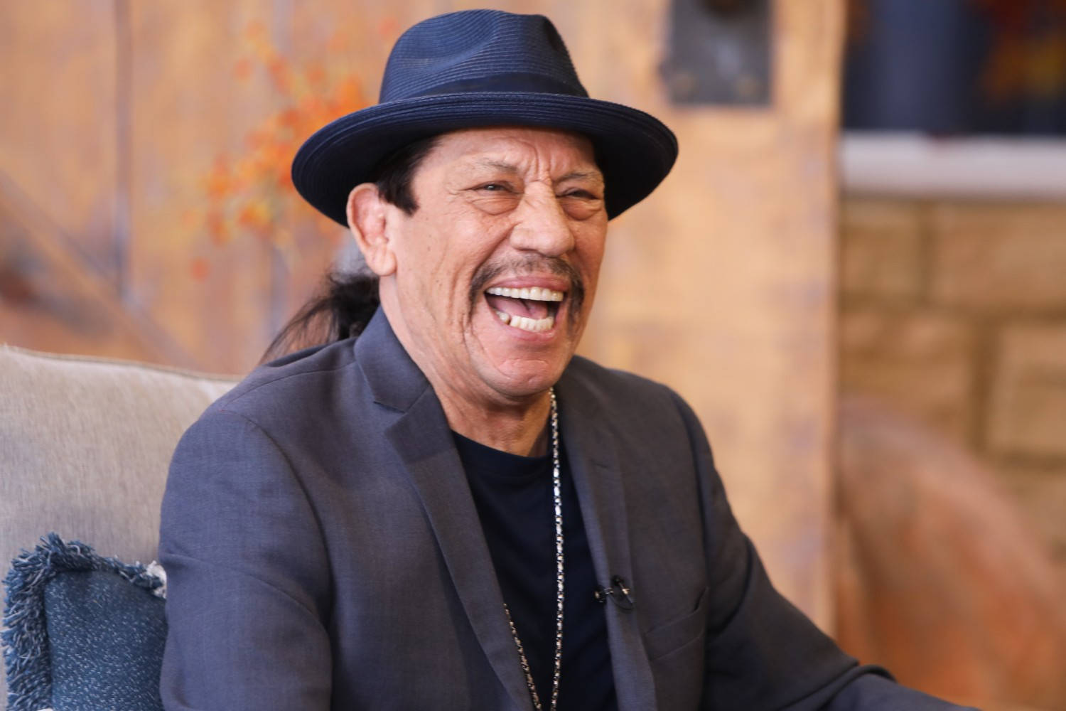 Danny Trejo Laughing In Talk Show Background