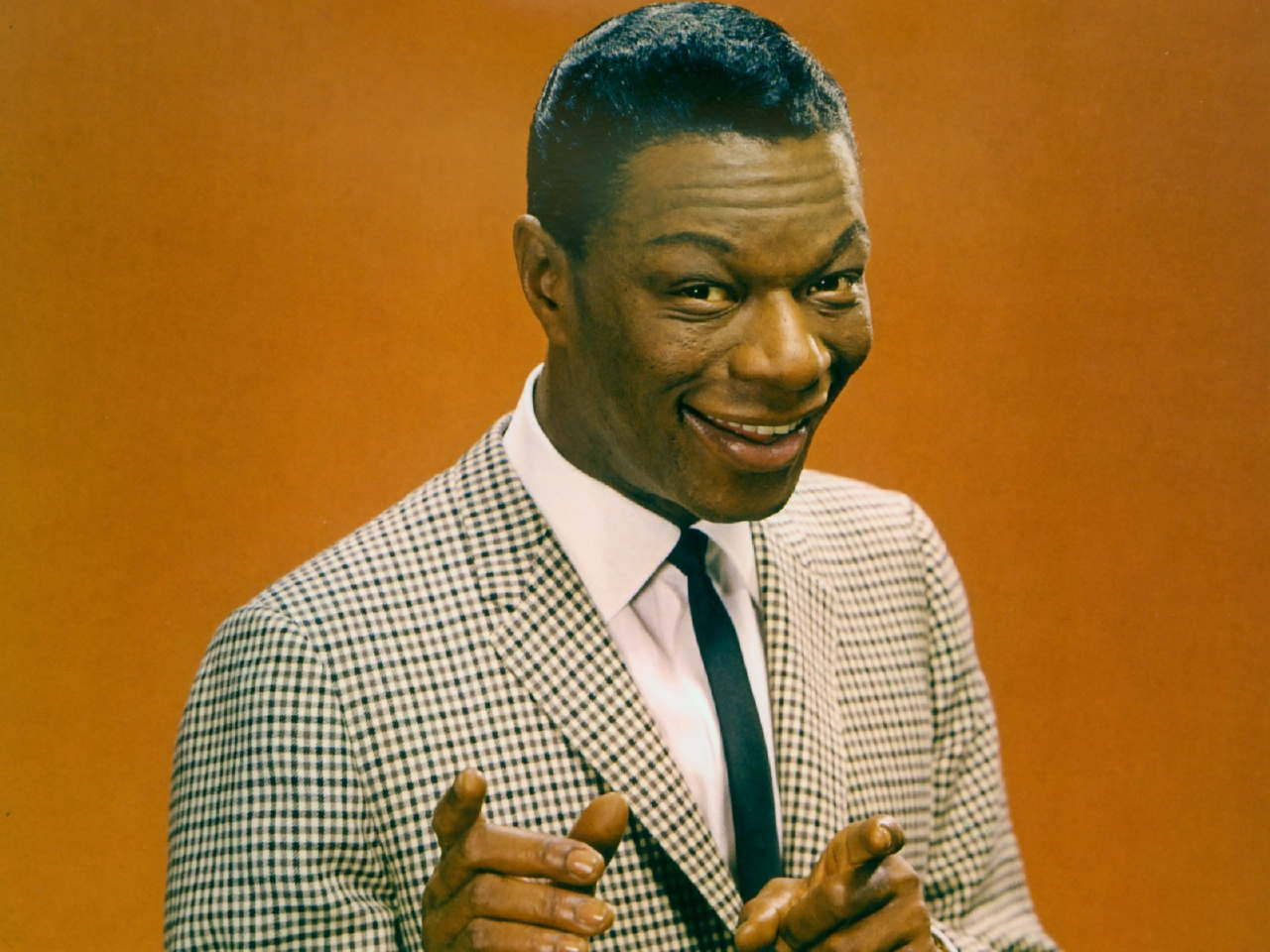 Legendary Nat King Cole in a Classic Photoshoot Wallpaper