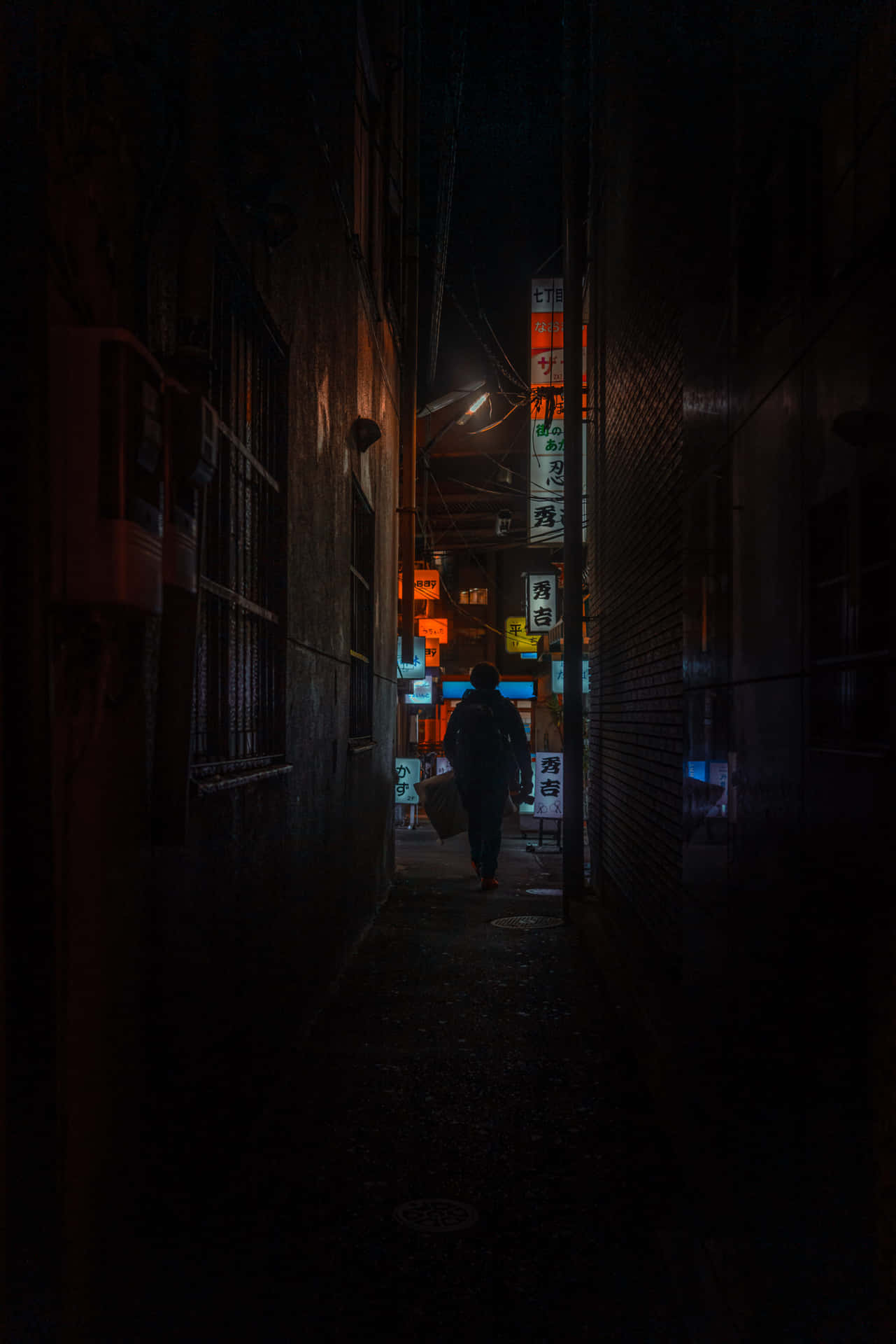 Dark_ Alley_with_ Illuminated_ Signs Wallpaper