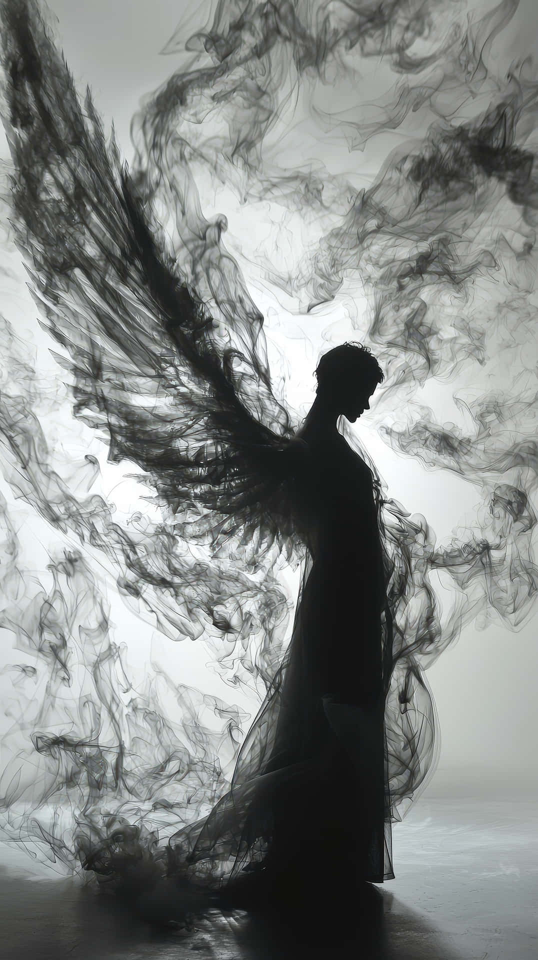 Dark Angel Figure Surrounded By Flowing Smoke-like Wings, Creating A Ghostly And Mystical Effect Wallpaper