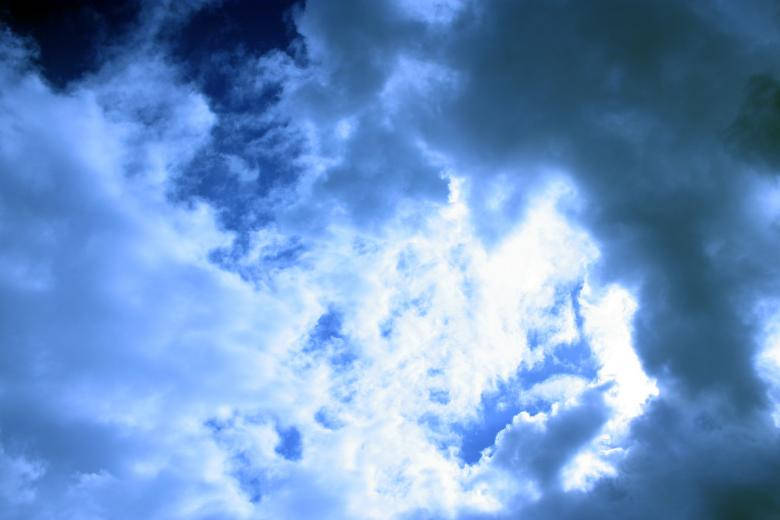 Dark Blue Clouds And Sun Rays Wallpaper