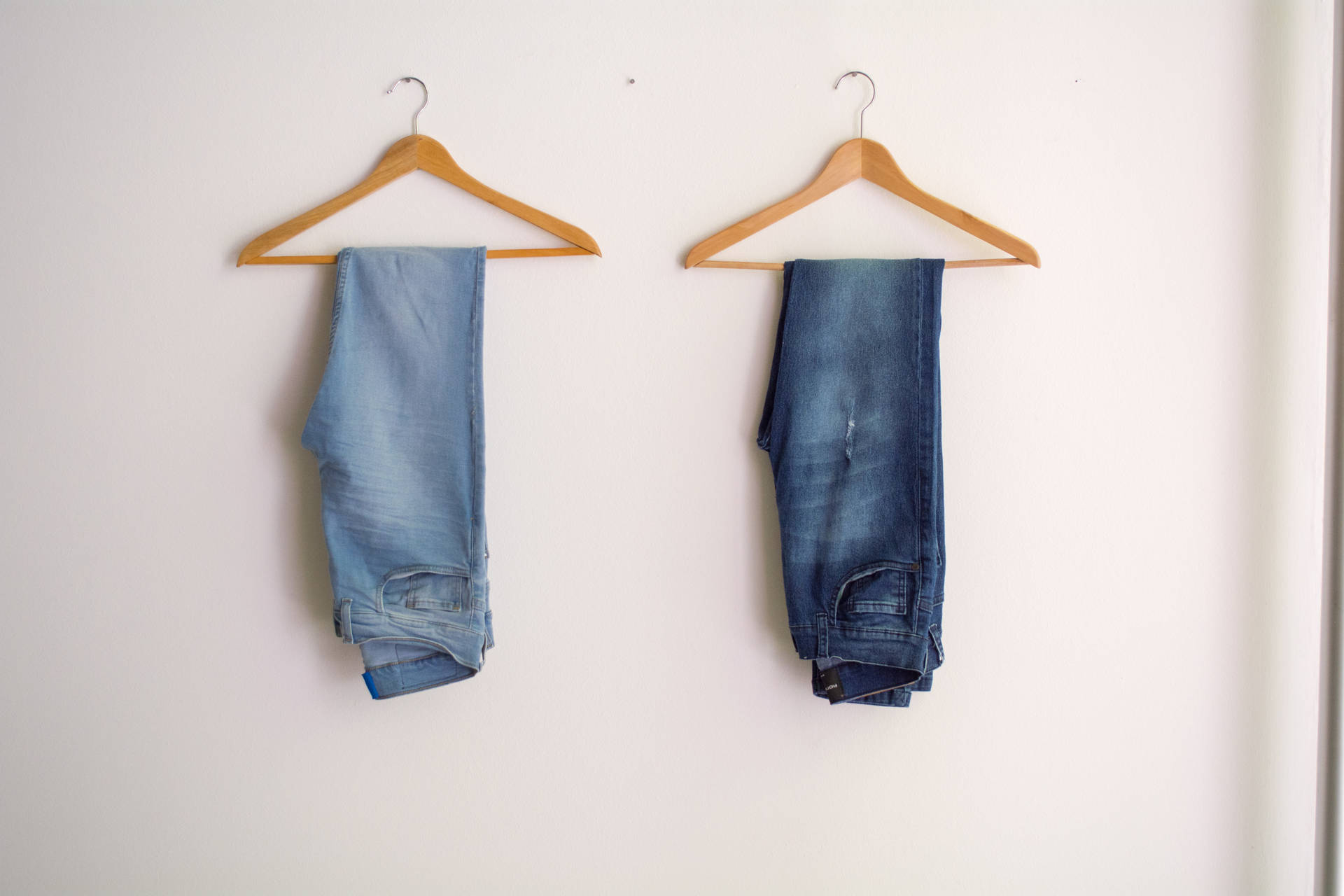 Dark Blue Denim Jeans On Hanger Background