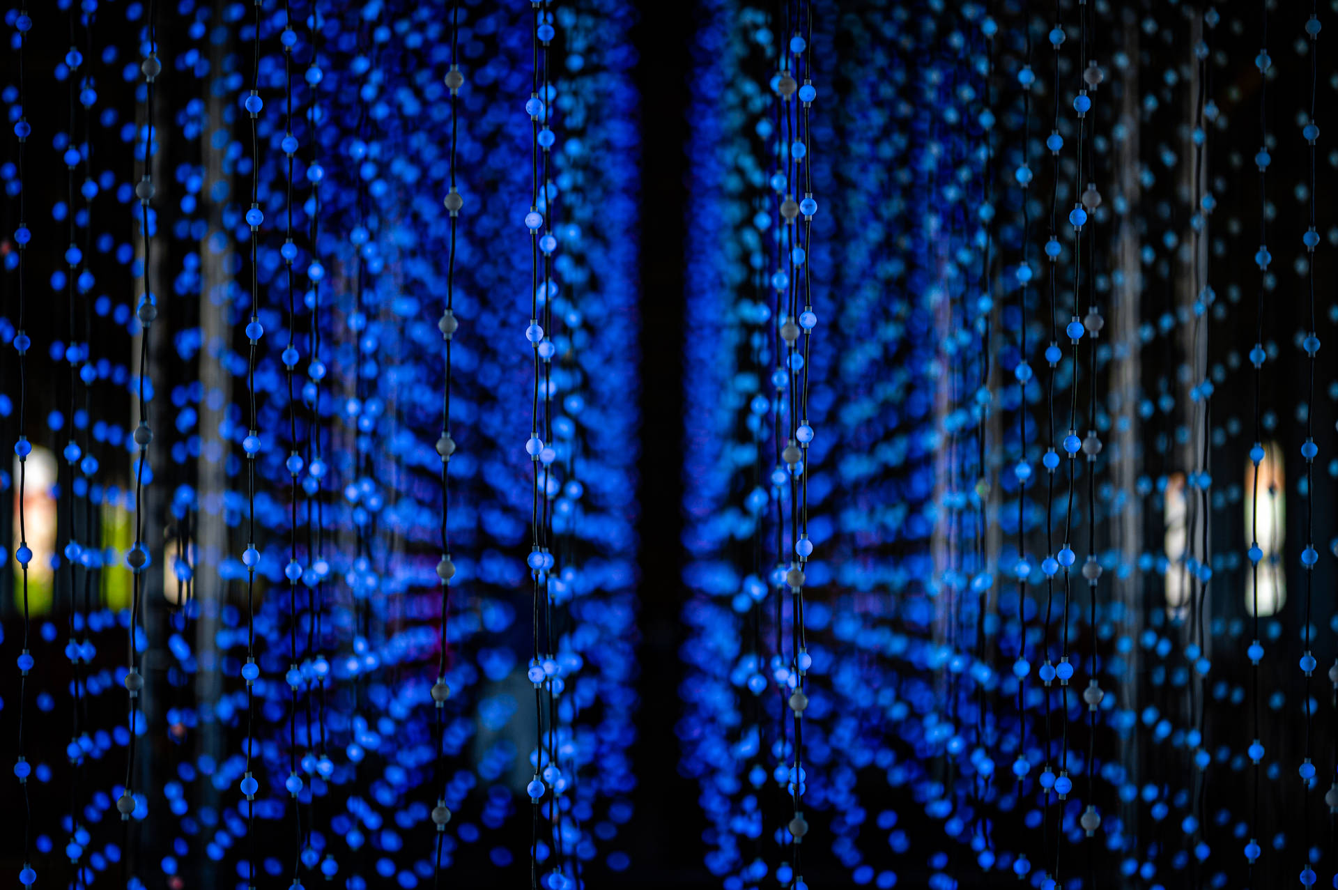 An alluring garland of dark blue lights. Wallpaper