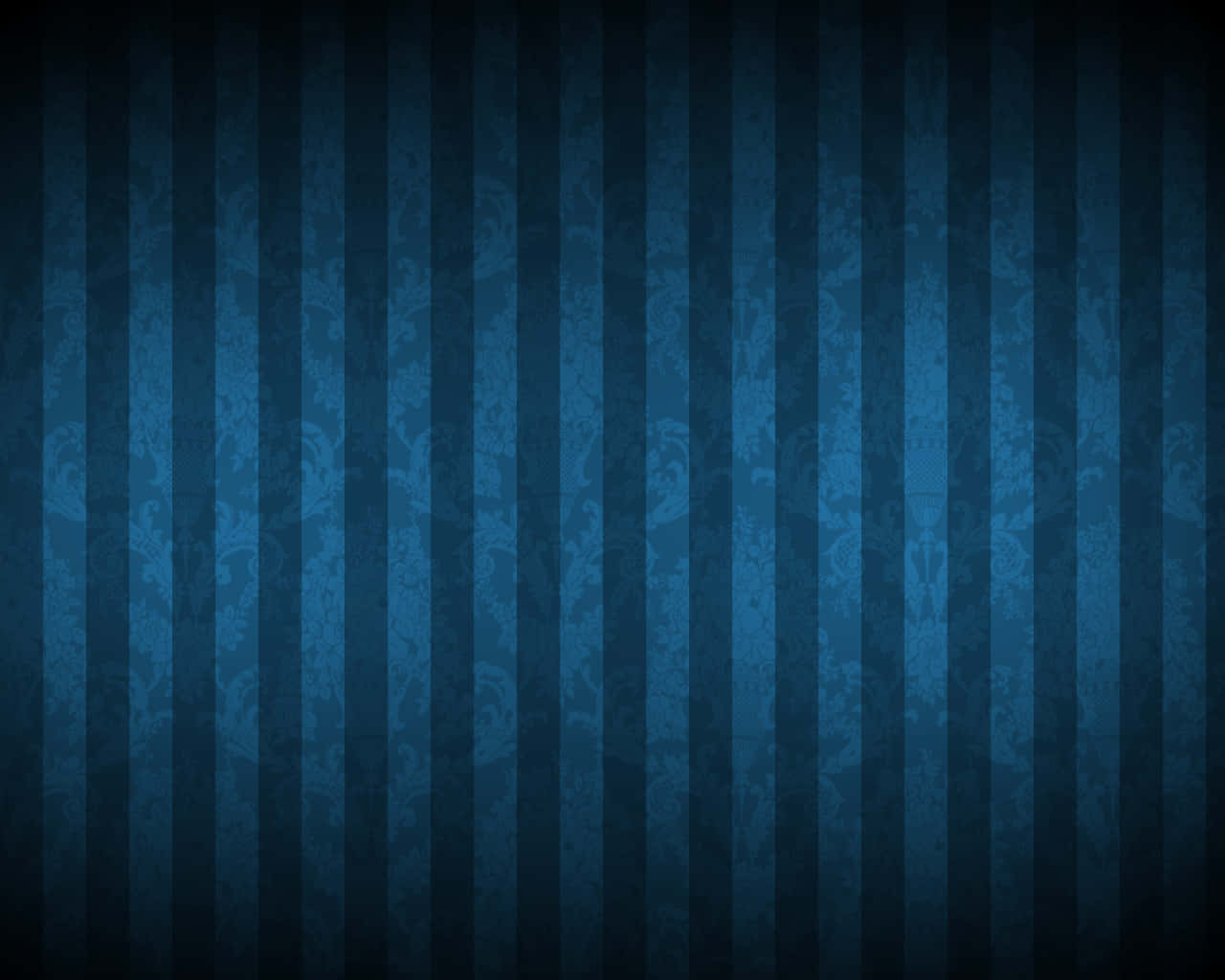 An intricate dark blue pattern on a beige background. Wallpaper