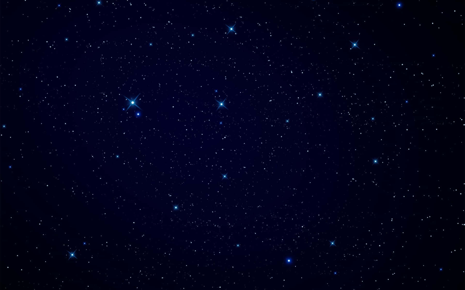 En livlig blå stjerne skinner klart i natte himlen. Wallpaper