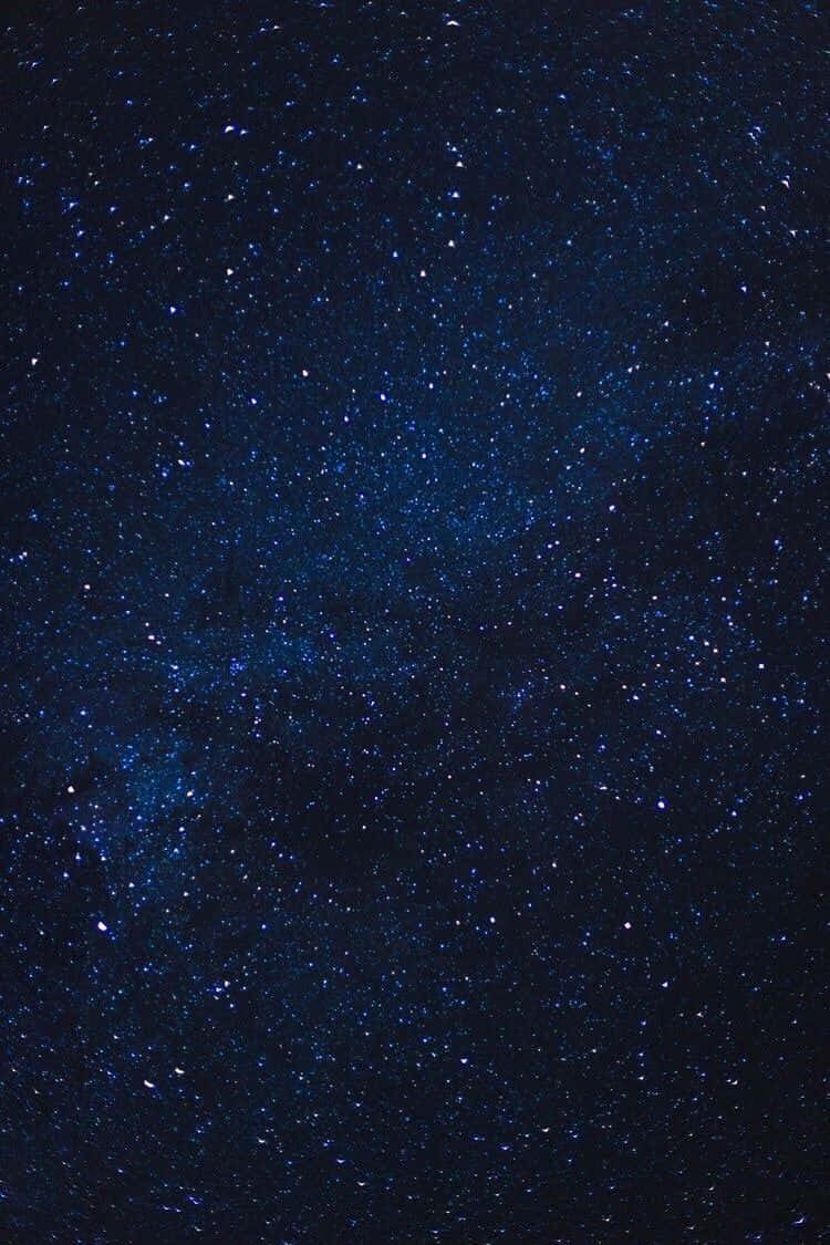 Mørk blå stjerne skinner på himlen Wallpaper