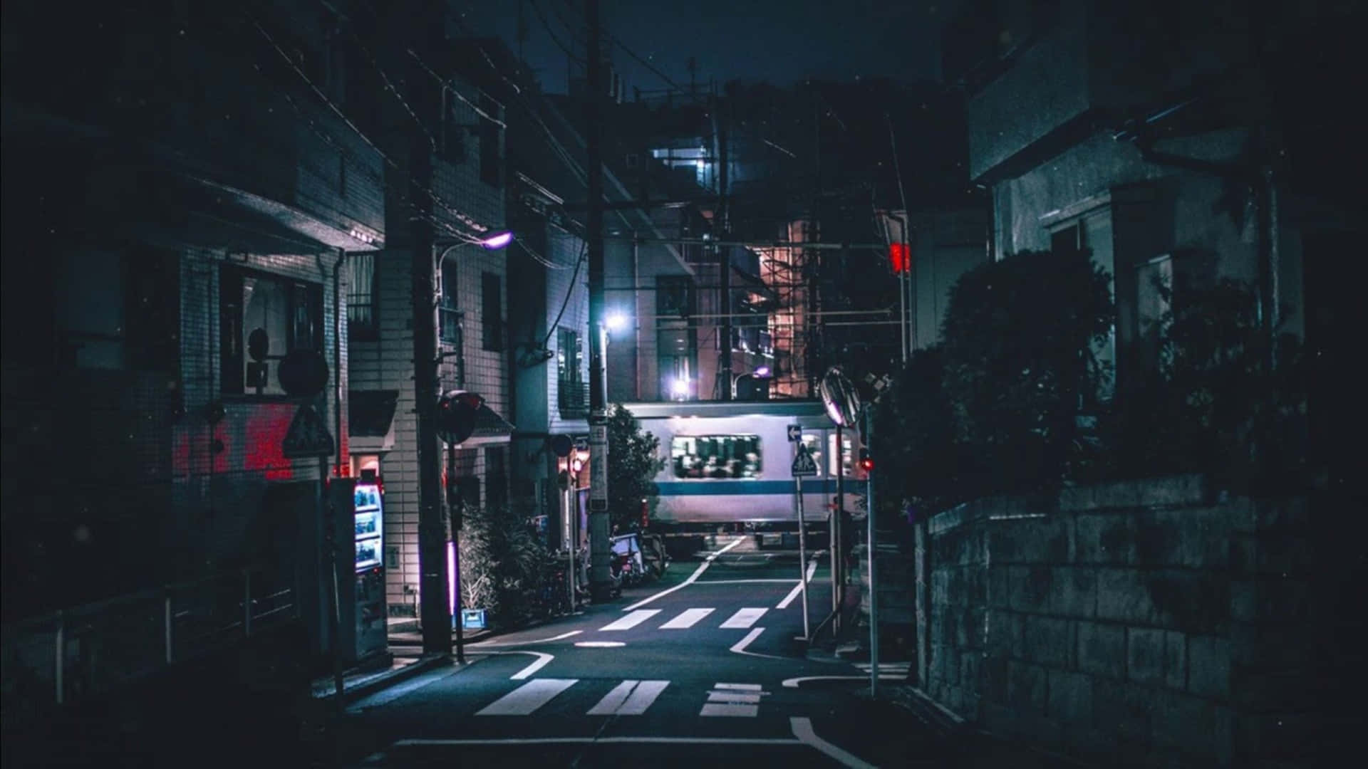 Einestraße In Tokyo Bei Nacht Wallpaper