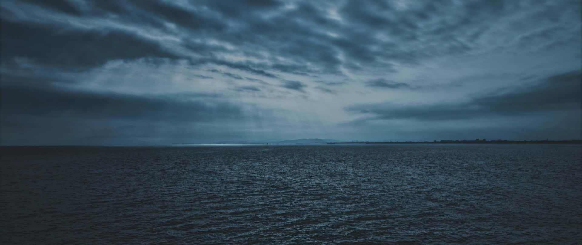 Dark Clouds Over Ocean4 K Wallpaper