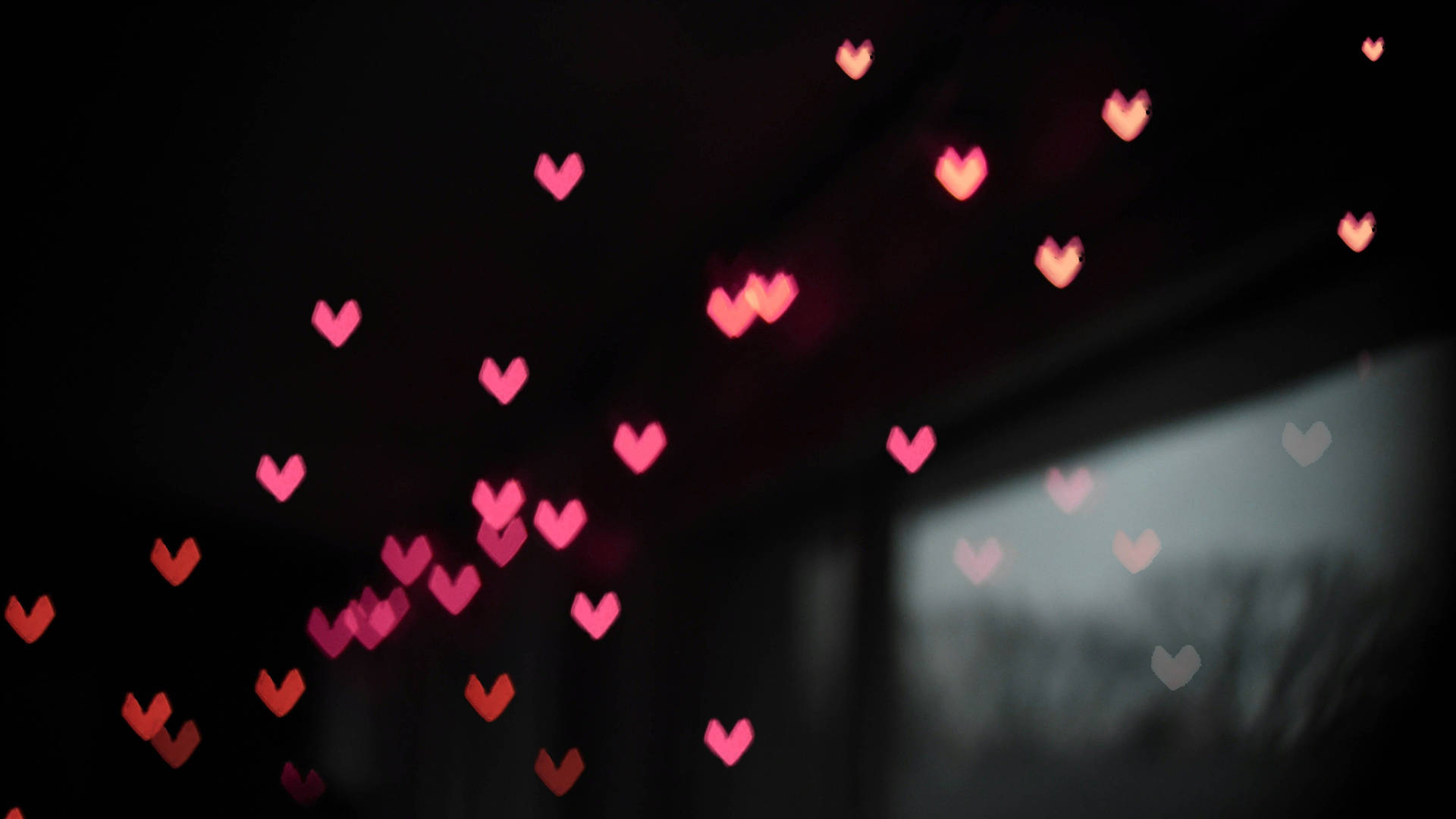 Sort hjertebillede med rosa hjerter og guldstjerner Wallpaper