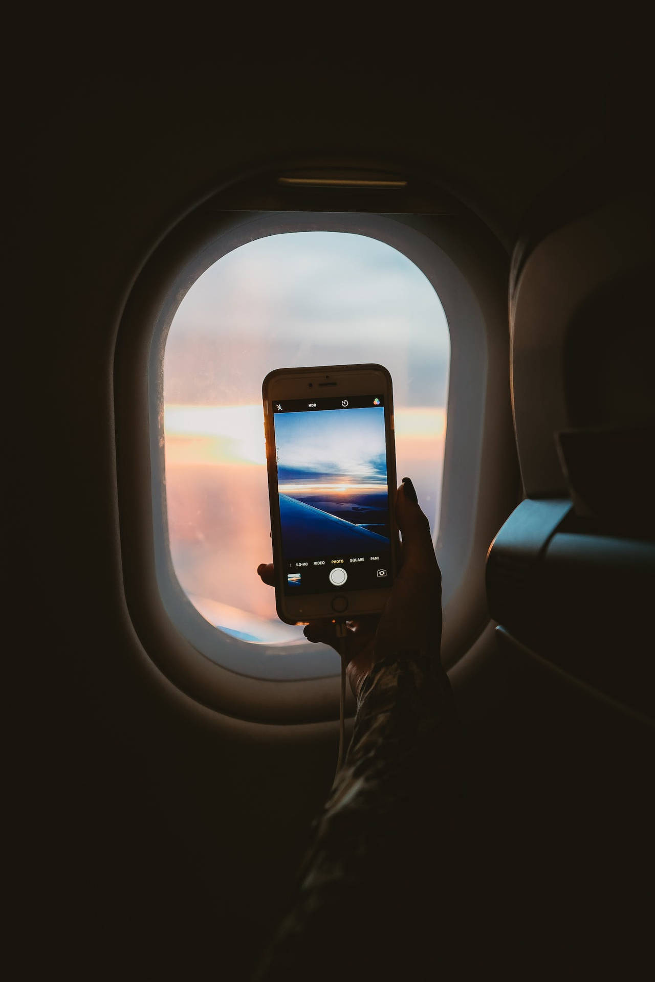 Dark Iphone On The Plane Wallpaper