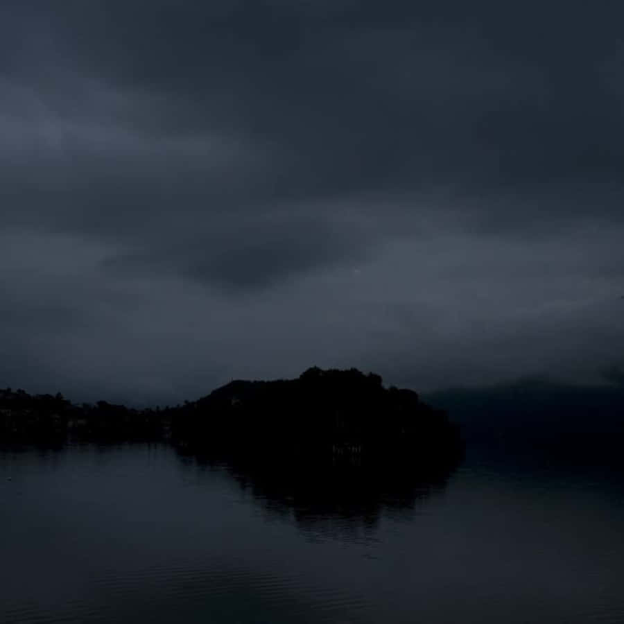 Mysterious Dark Island on a Foggy Night Wallpaper