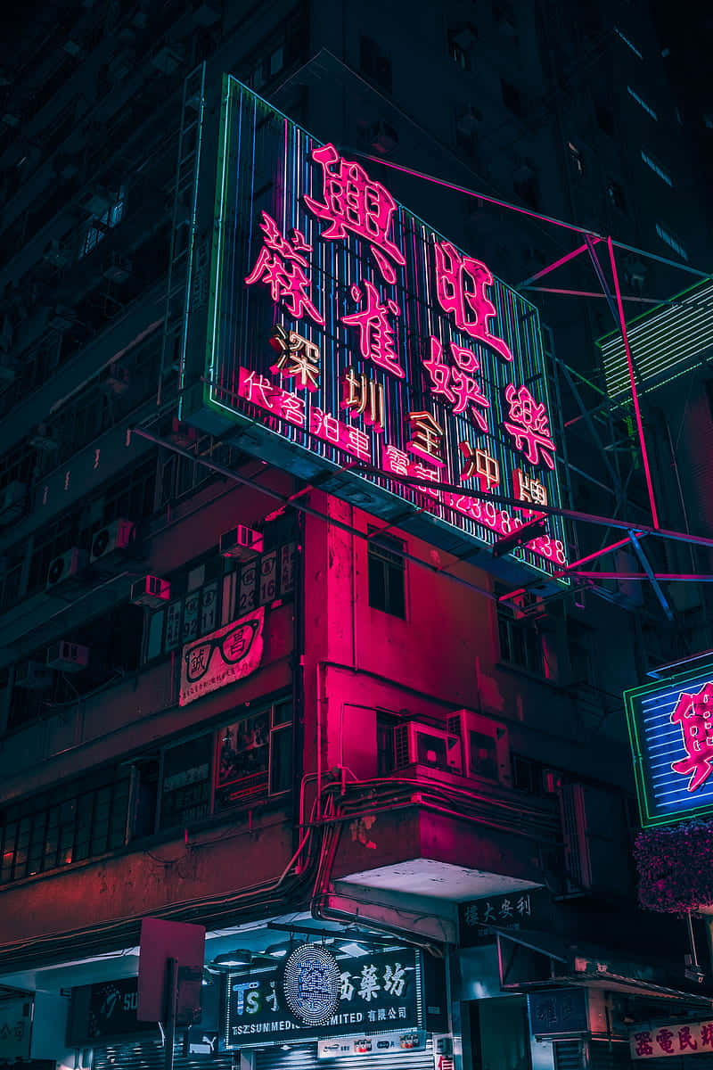 Download neon sign on a building Wallpaper | Wallpapers.com