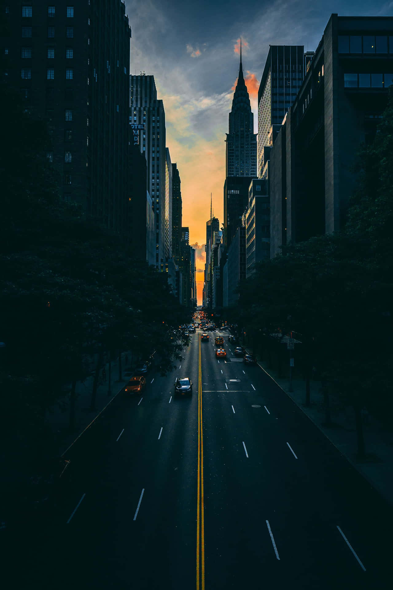 A City Street With Cars Wallpaper