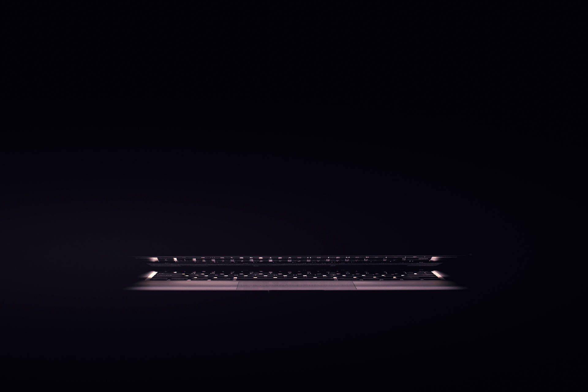 Illuminated Dark Laptop Keyboard Wallpaper