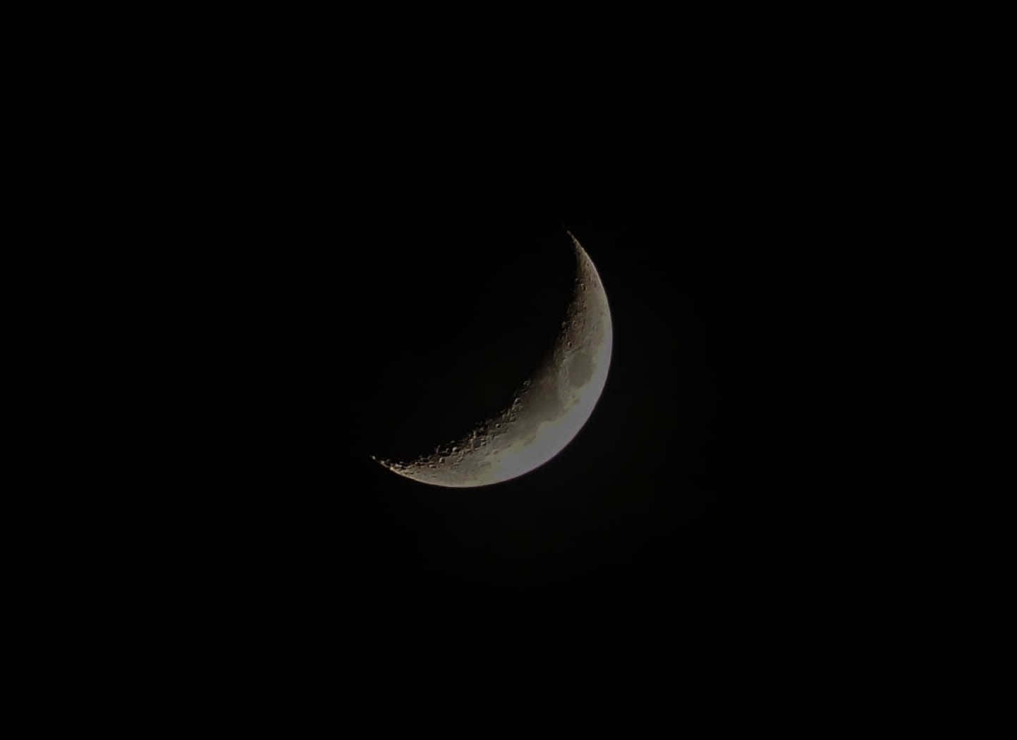 Dark Moon Illuminating the Night Sky Wallpaper