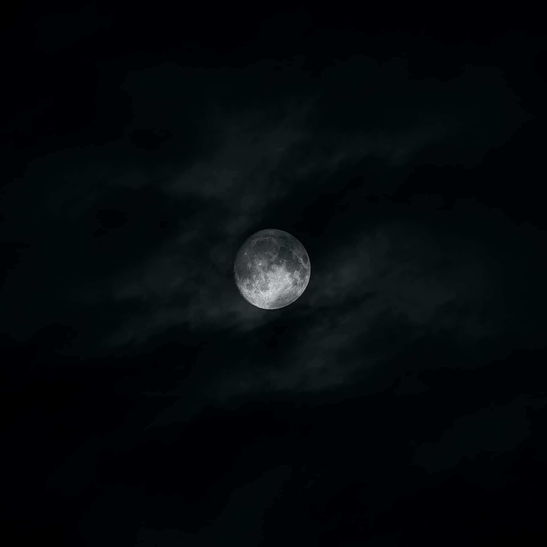 Mystical Dark Moon illuminating the night sky Wallpaper
