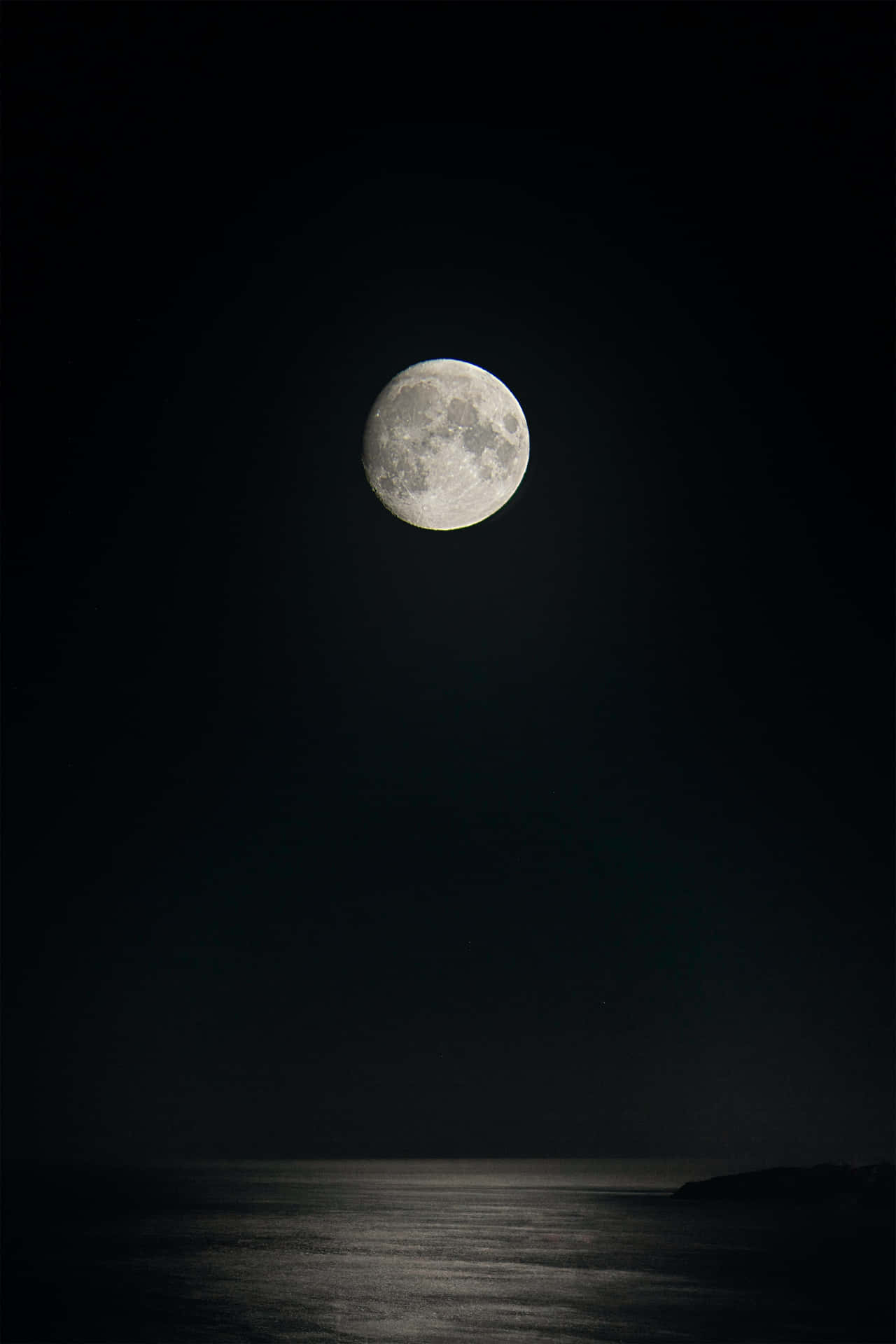 Mysterious Dark Moon in Night Sky Wallpaper