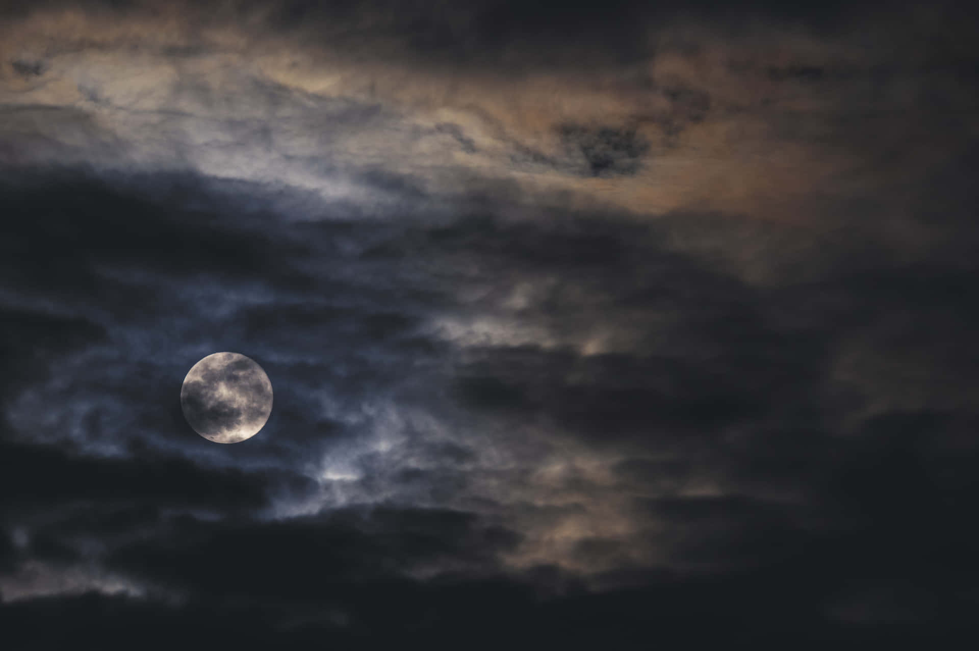 Dark Moon Illuminating the Night Sky Wallpaper