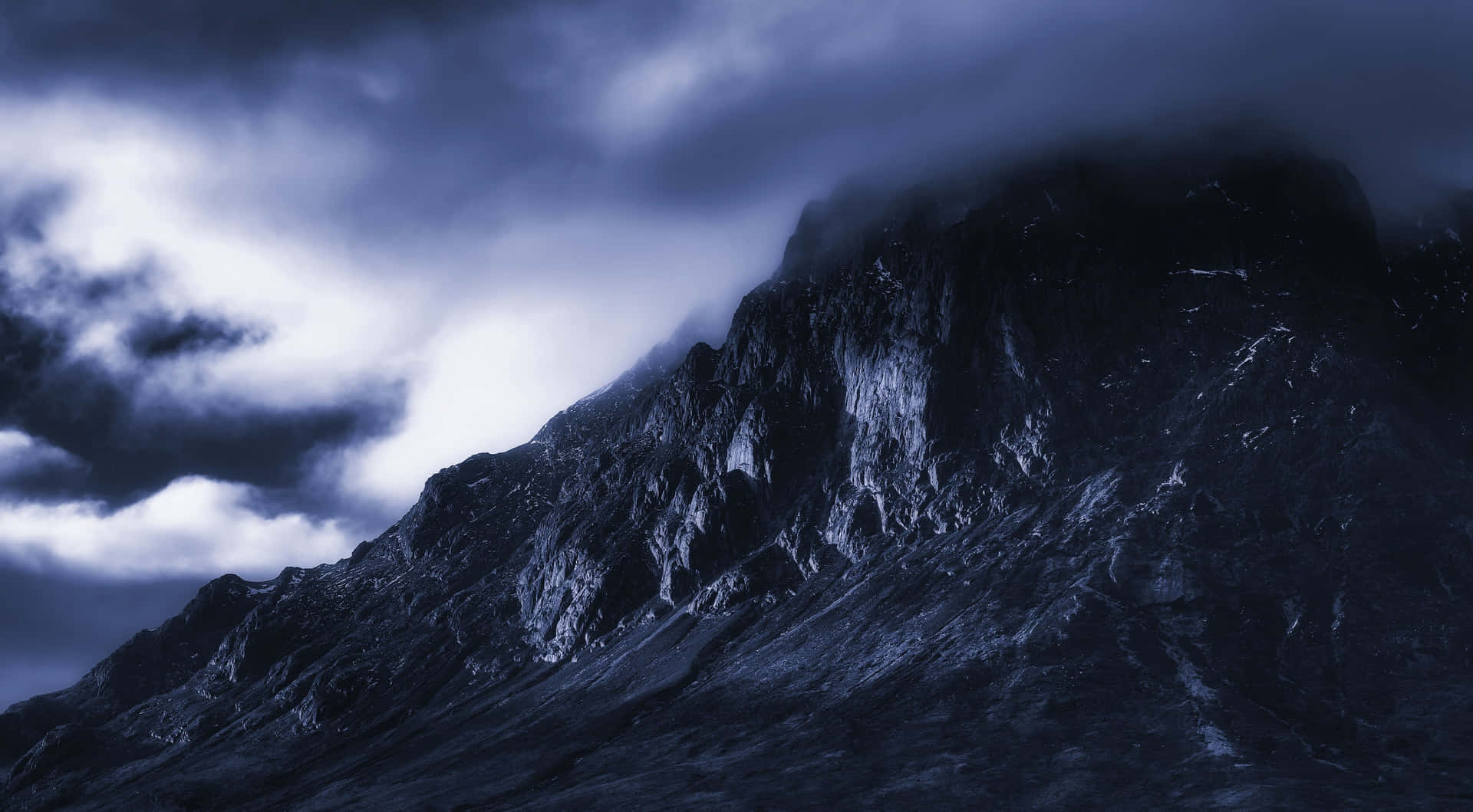 Majestic Dark Mountain under a Starry Night Sky Wallpaper