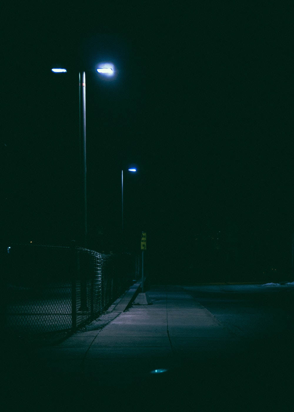 temerario Oral La base de datos Download Dark Night Sidewalk With Light Wallpaper | Wallpapers.com