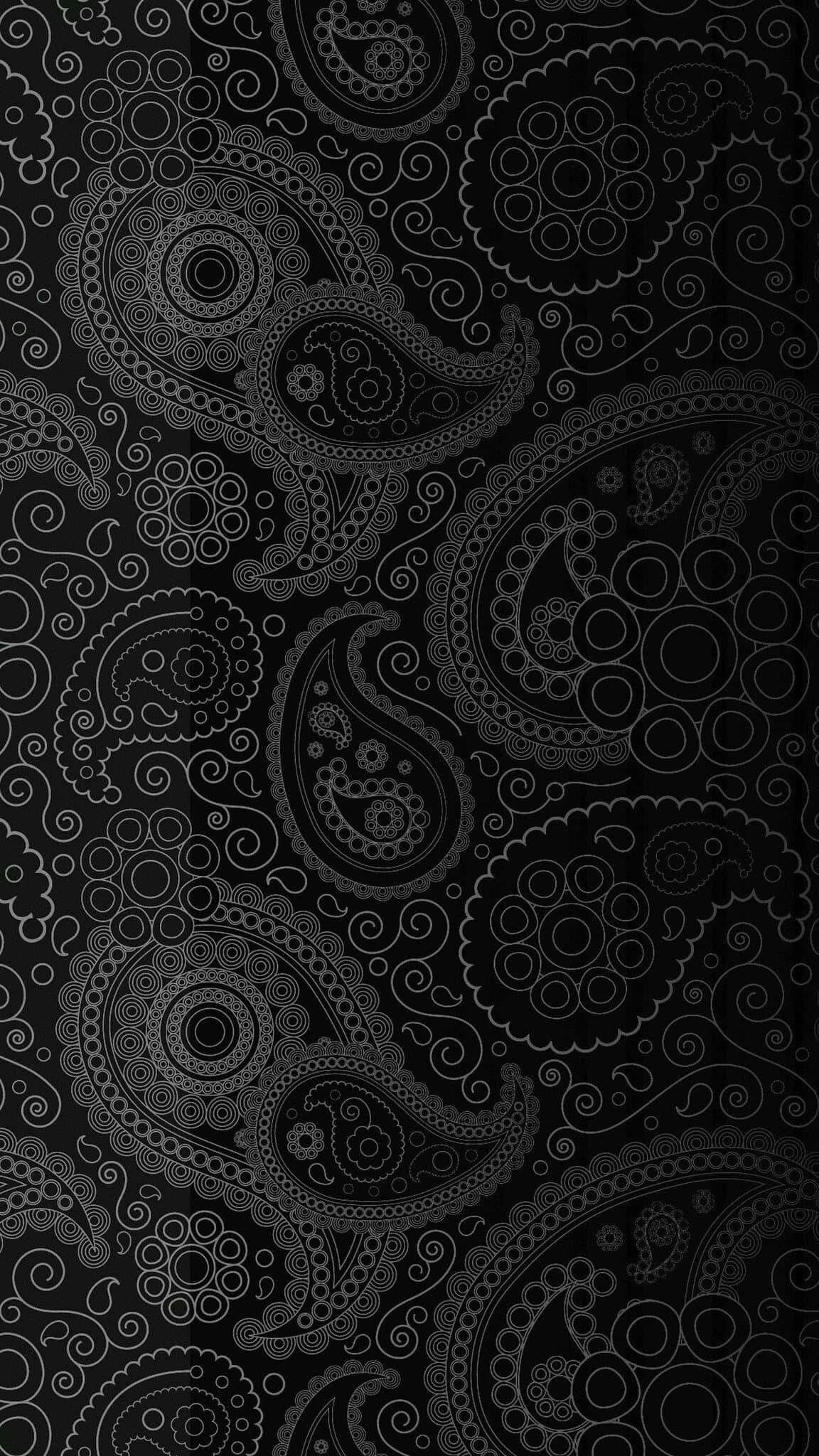 A Black And White Paisley Pattern On A Black Background