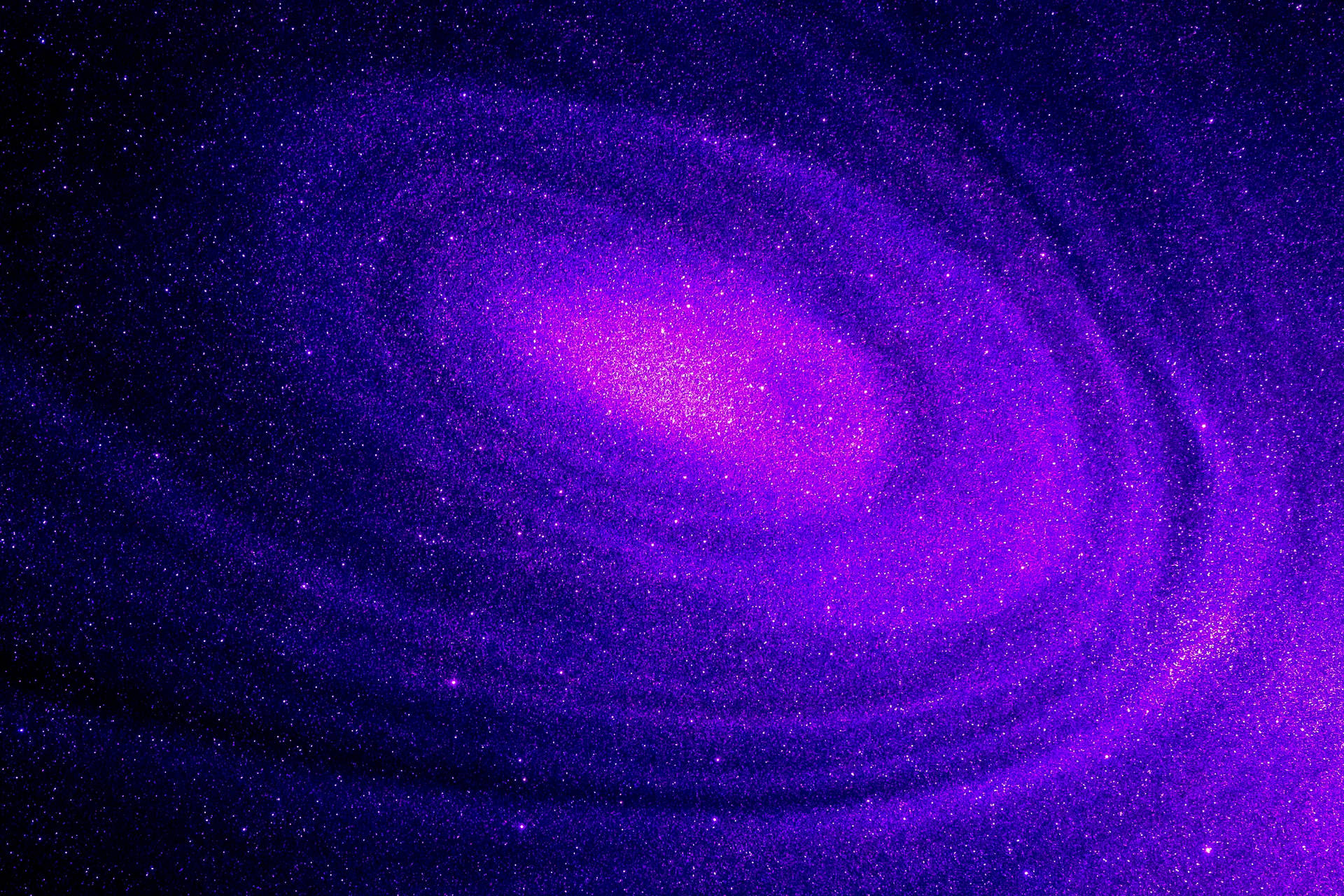A Purple Spiral Galaxy With Stars In The Background Wallpaper