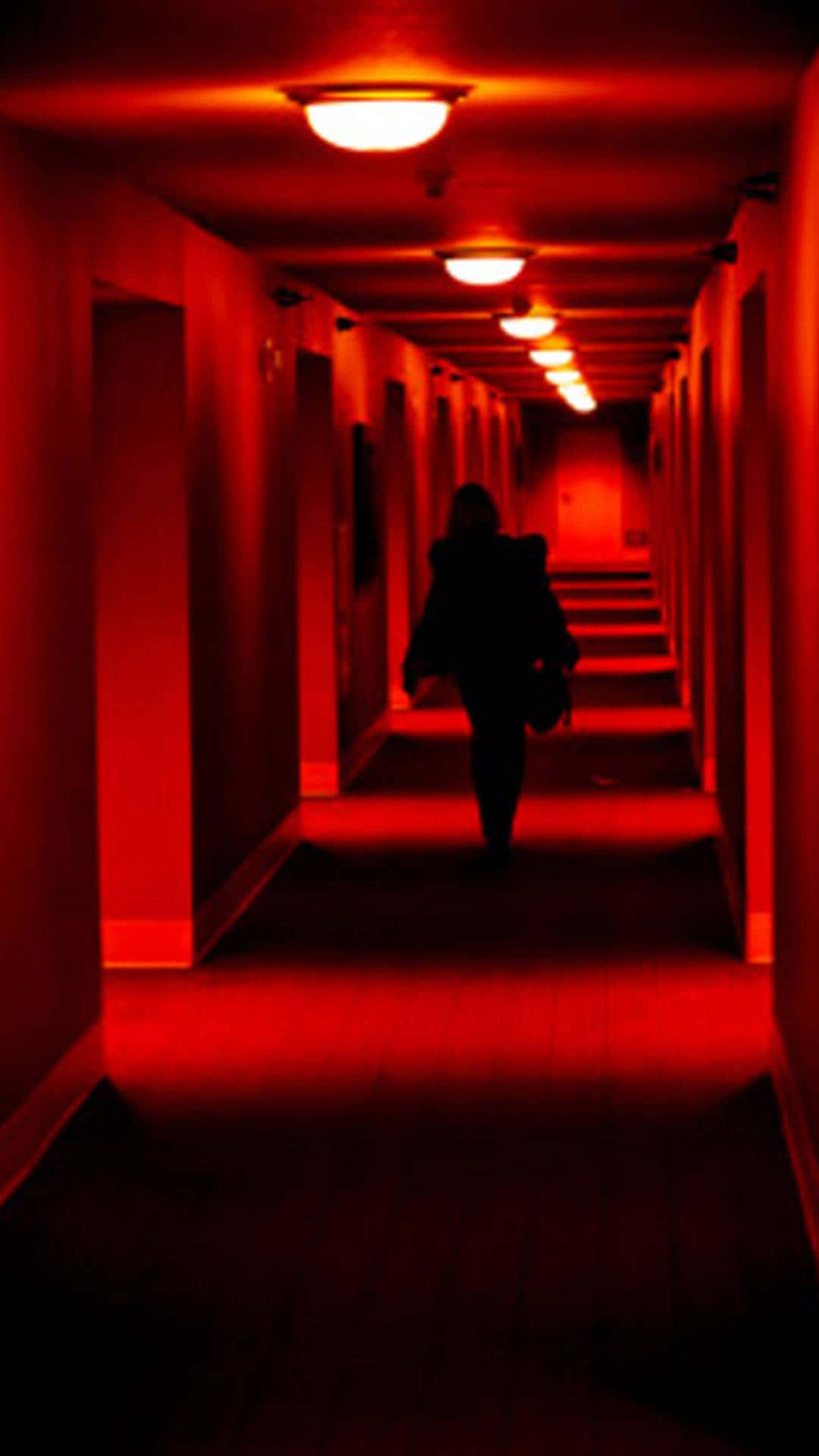 Woman Walking In A Hall Dark Red Aesthetic Wallpaper
