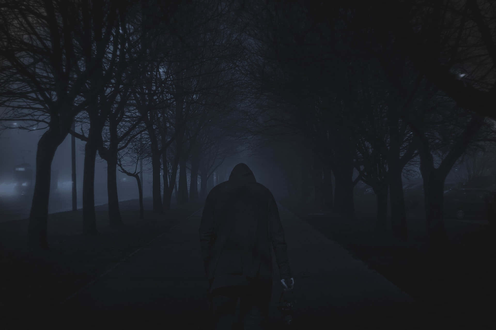 A mysterious dark road at twilight Wallpaper