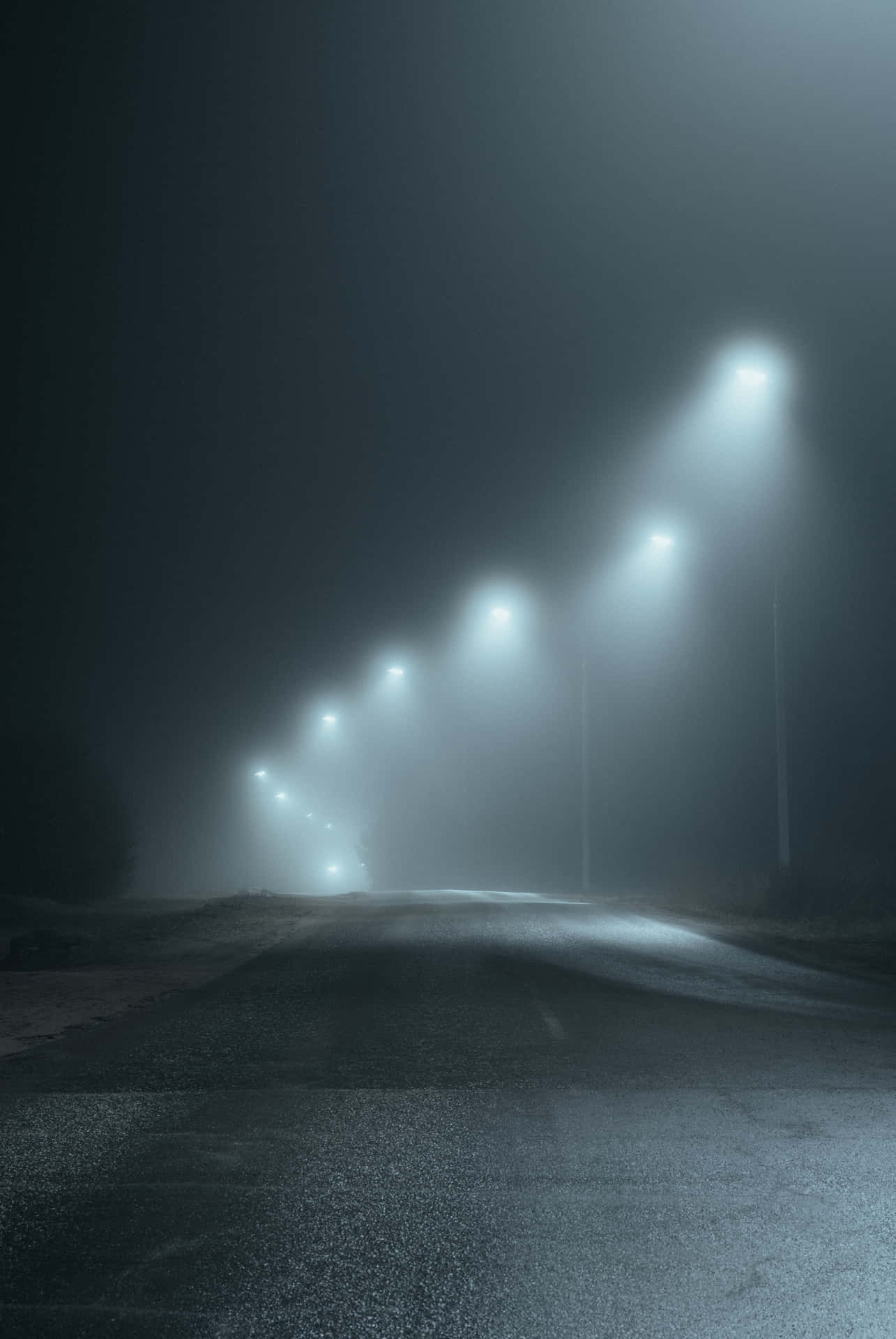 Mysterious Dark Road at Night Wallpaper