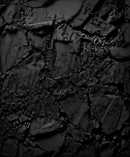 Captivating Dark Rock Formation Wallpaper