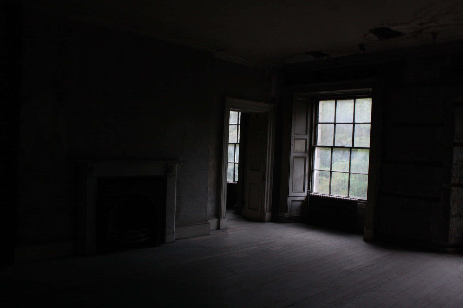 A Room With A Fireplace And A Window