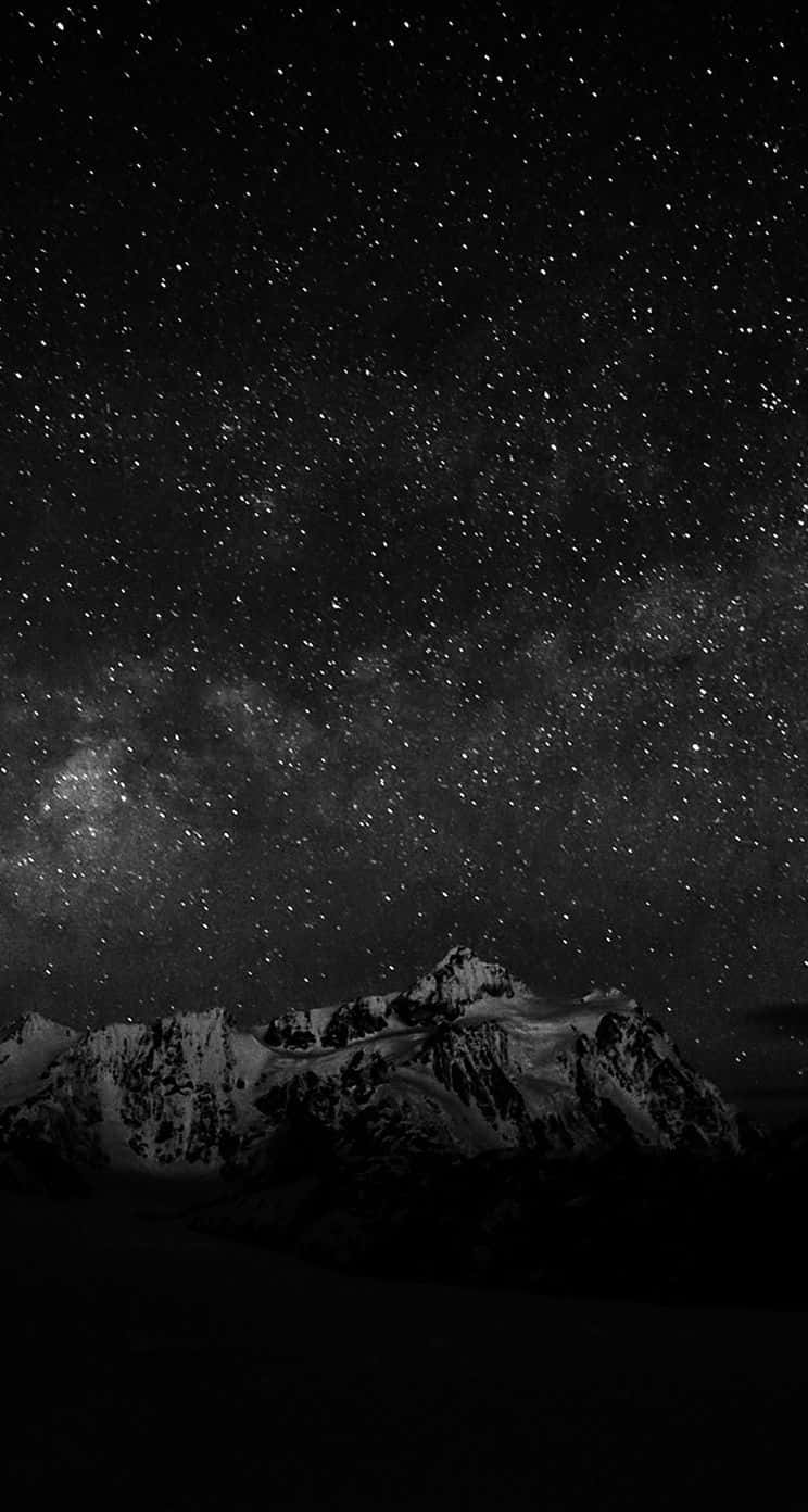 Unaimpresionante Vista De La Noche Estrellada Bajo Un Cielo Oscuro. Fondo de pantalla