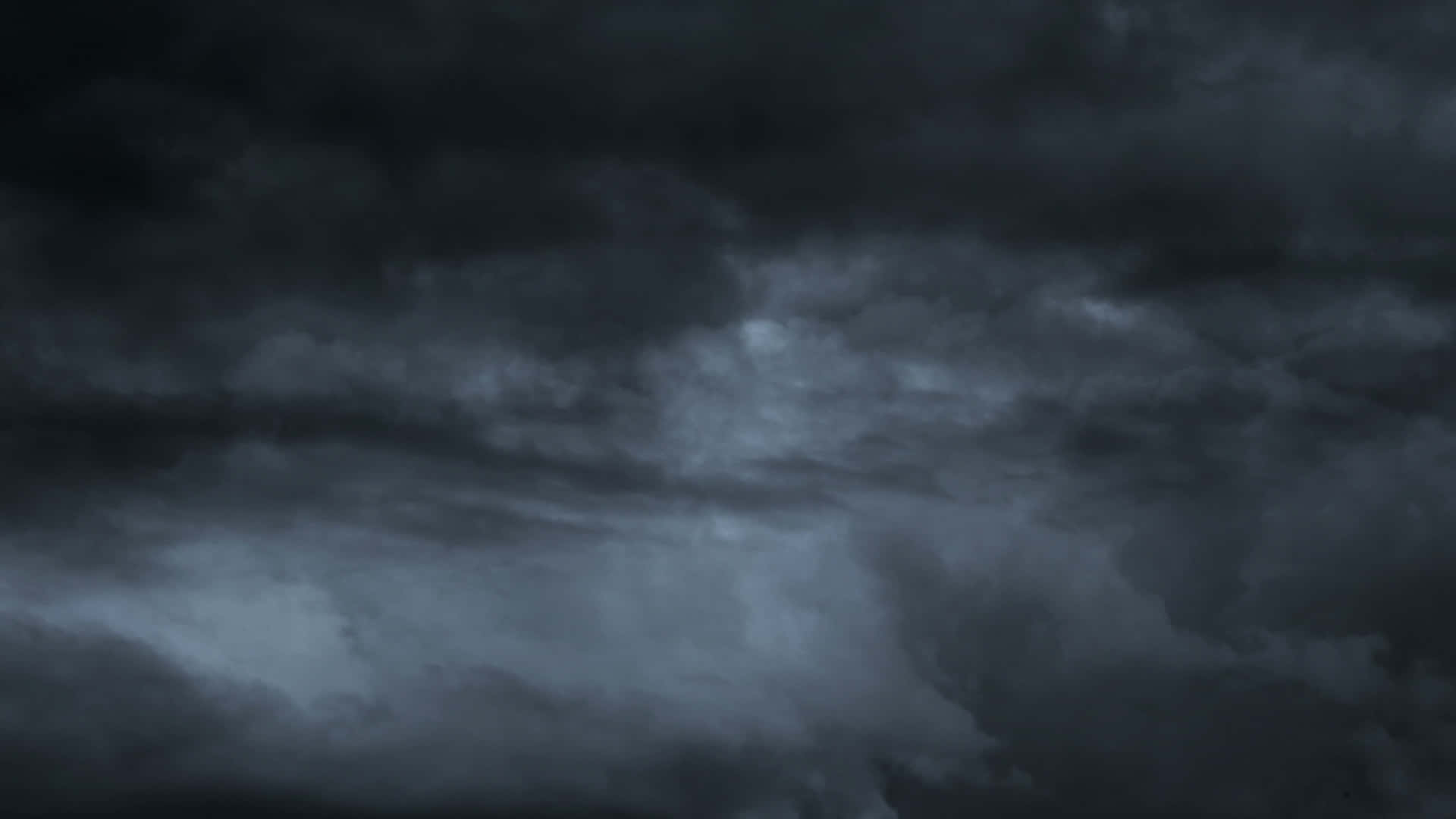 Dark Storm Approaching over a Barren Landscape Wallpaper