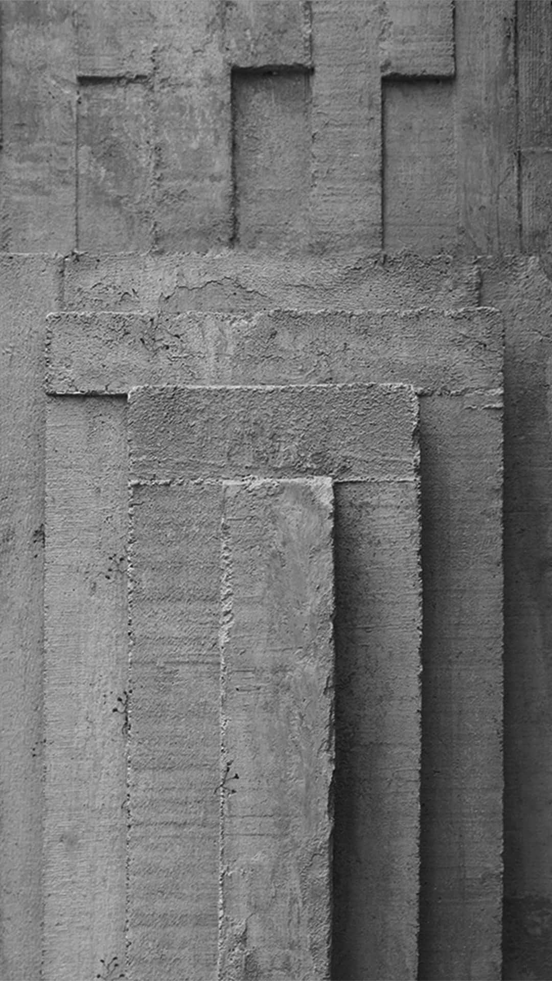 A Black And White Photo Of A Concrete Wall