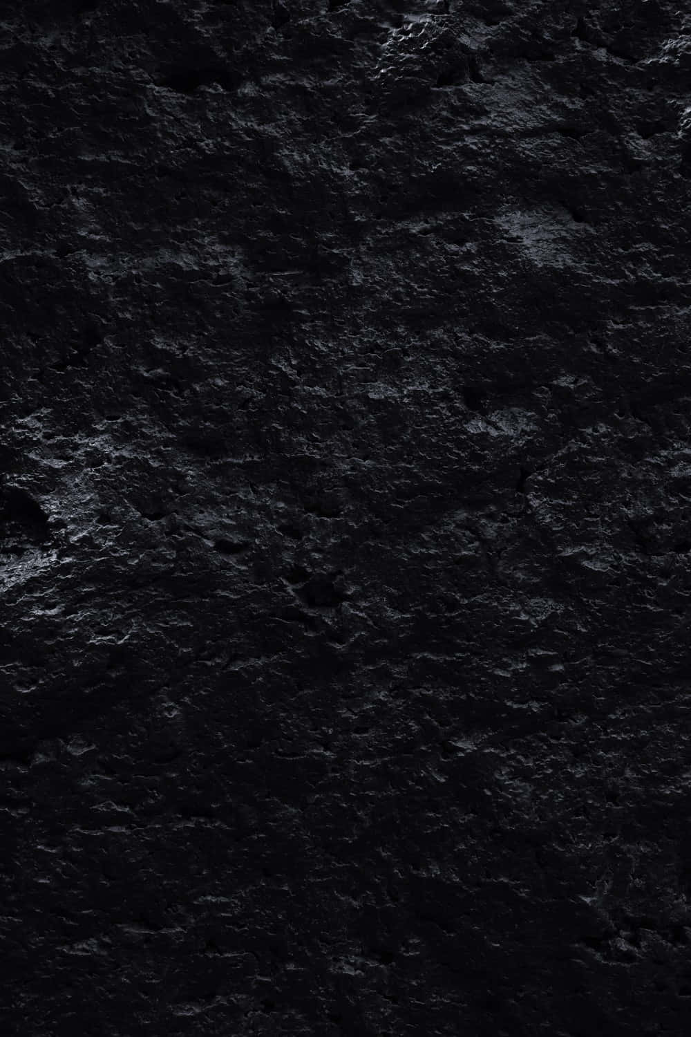 A Black Stone Wall With A Black Background