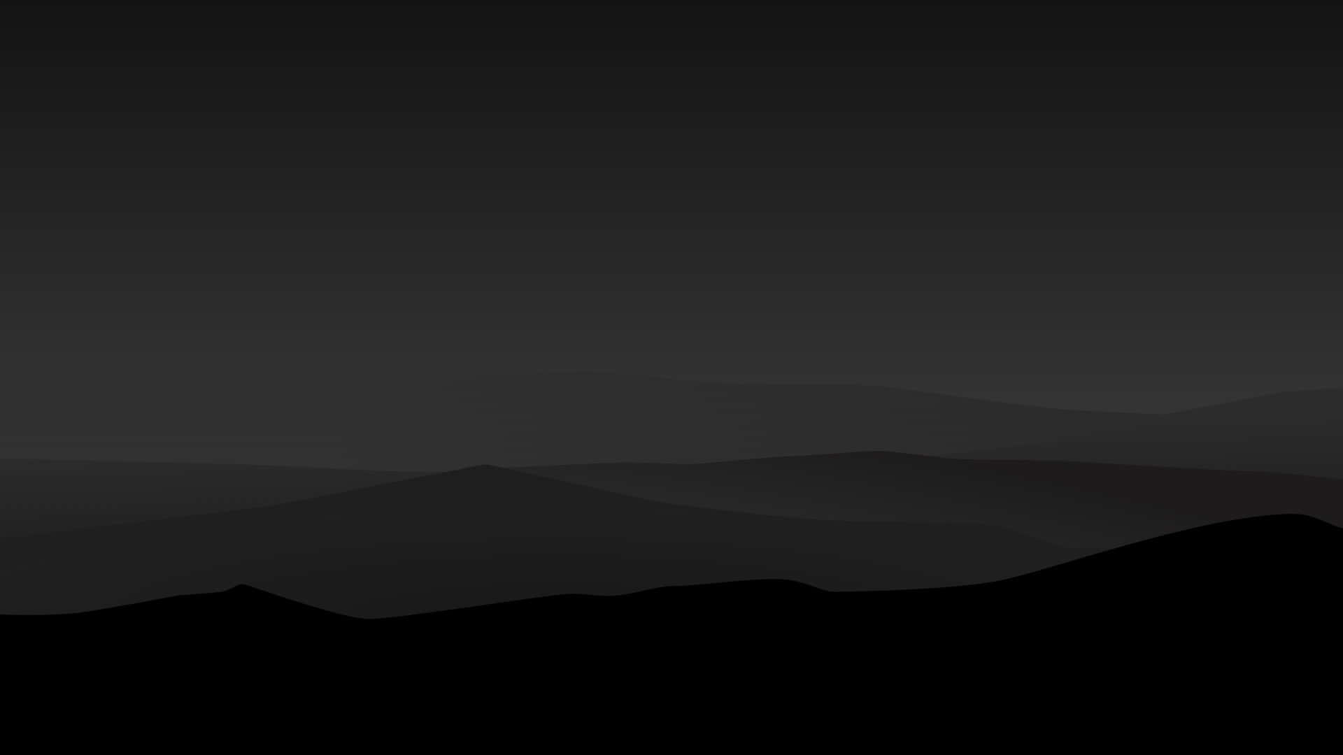 A Black Silhouette Of Mountains With A Dark Sky
