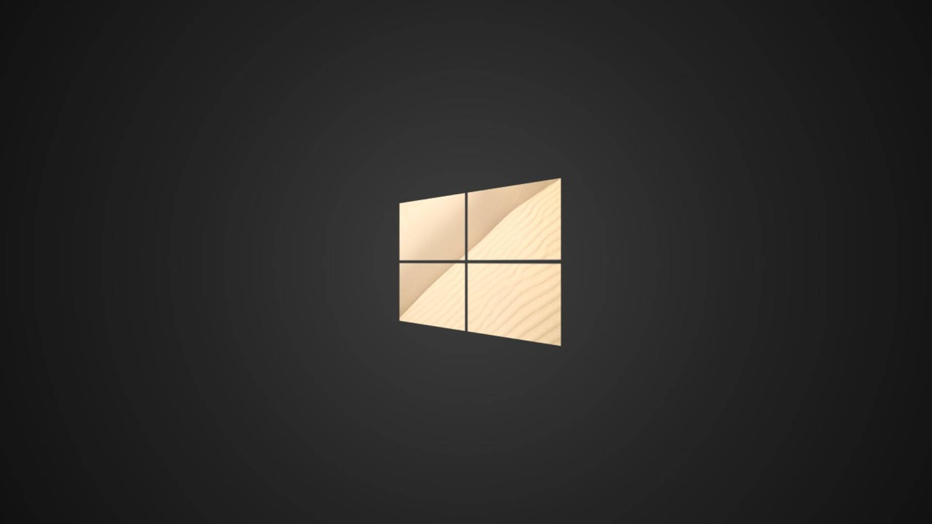 Caption: Shimmering Golden Windows Logo on a Dark Background Wallpaper