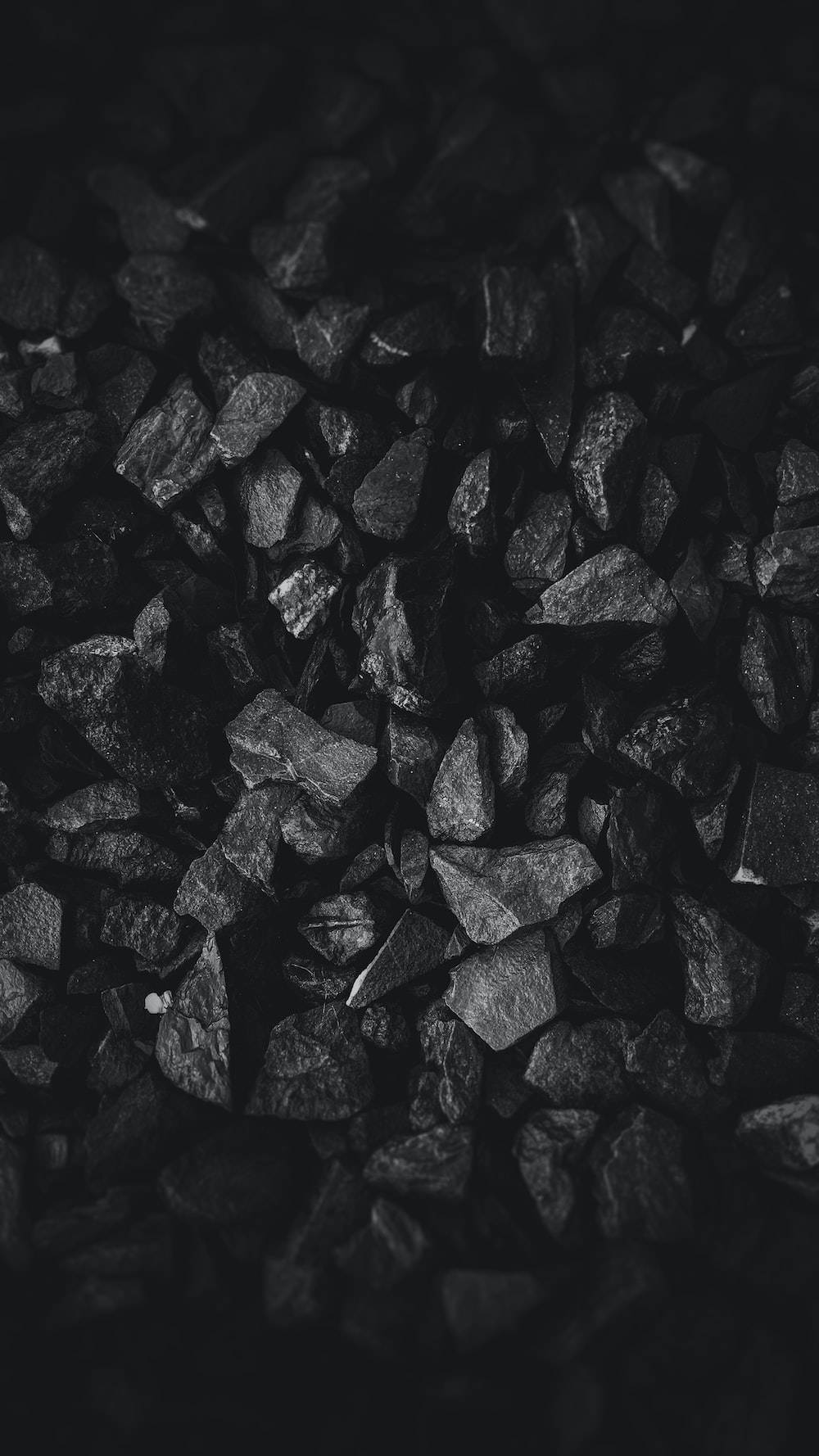 Dark Theme Pile Of Charcoal Wallpaper