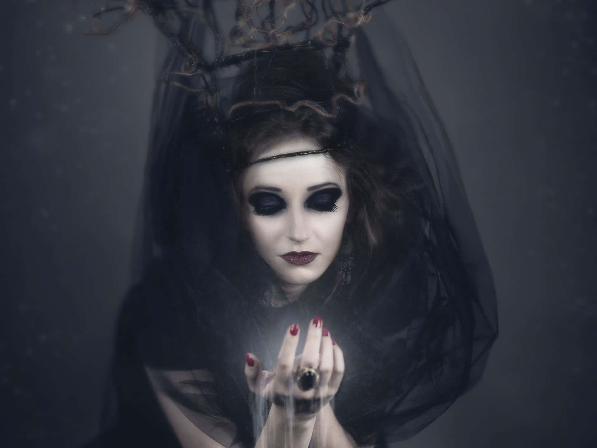 Enchanting Dark Witch in Moonlit Forest Wallpaper