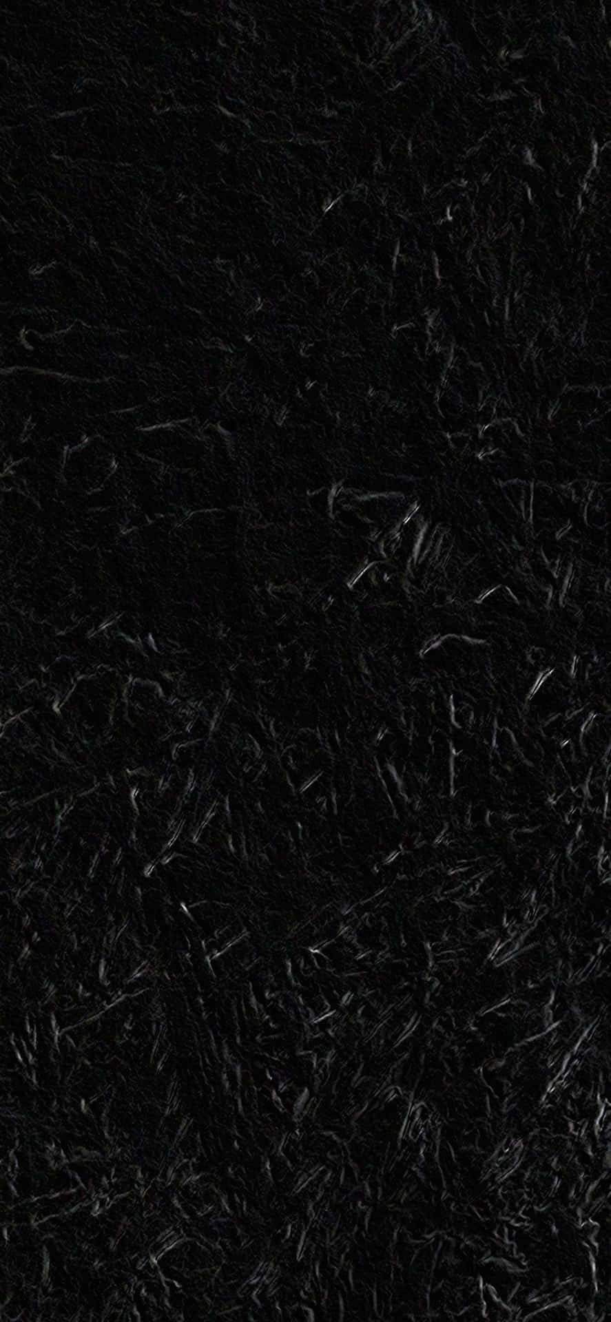 Einschwarzer Teppich Mit Einem Schwarzen Hintergrund. Wallpaper