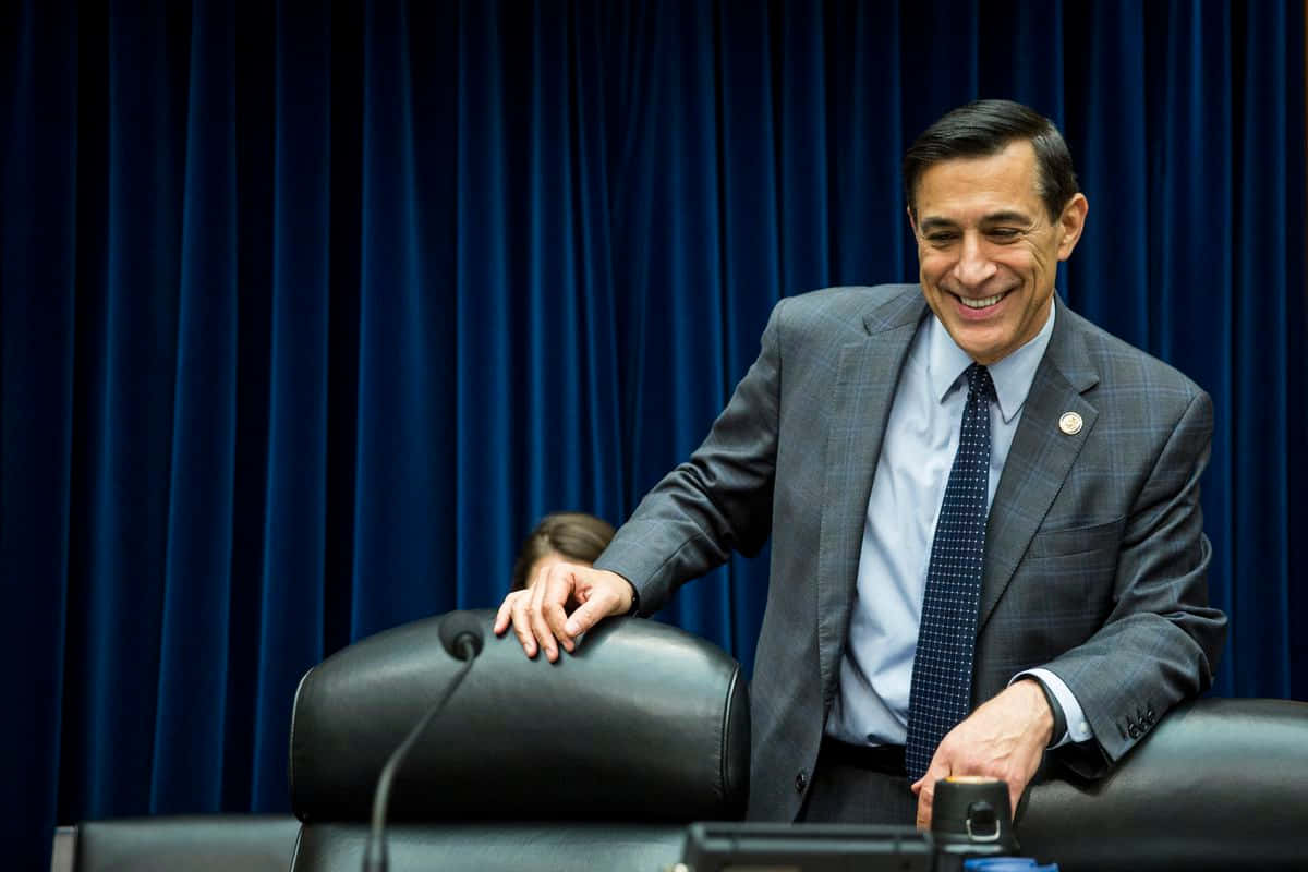 Darrell Issa About To Sit On Chair Wallpaper