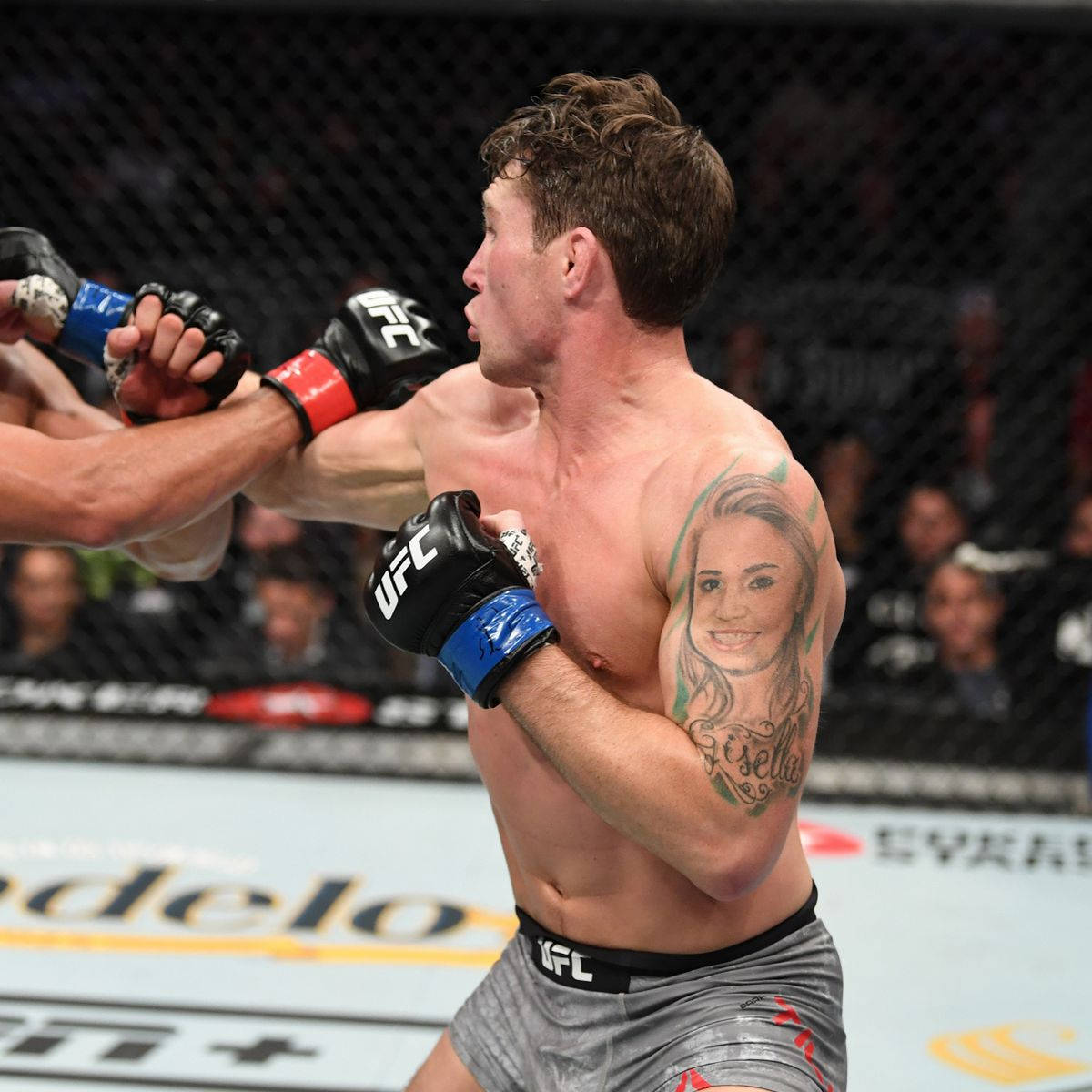 Caption: Darren Till Caught in Fast-Paced Fight Action Wallpaper